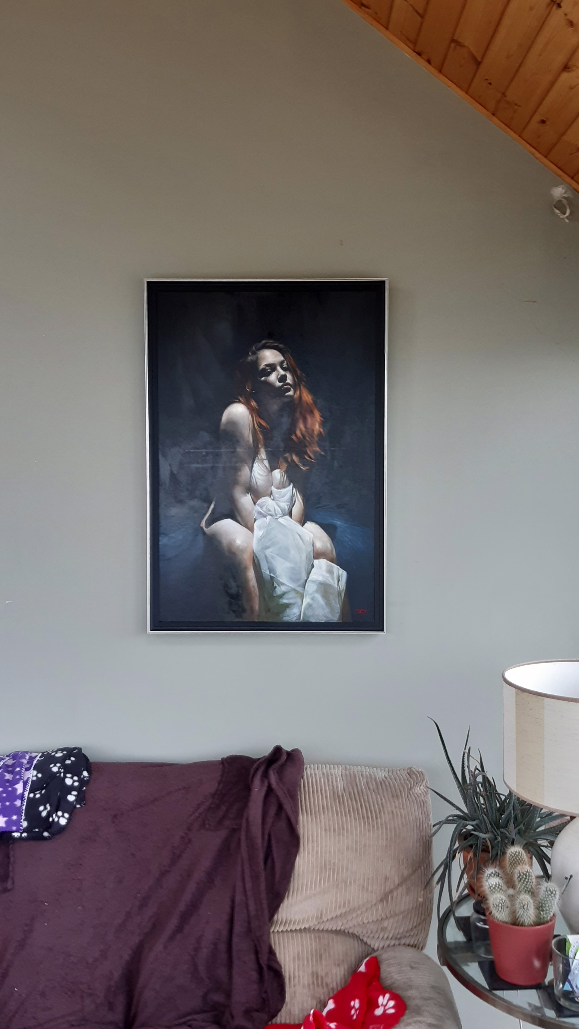 A painting of a woman sitting on a chair.