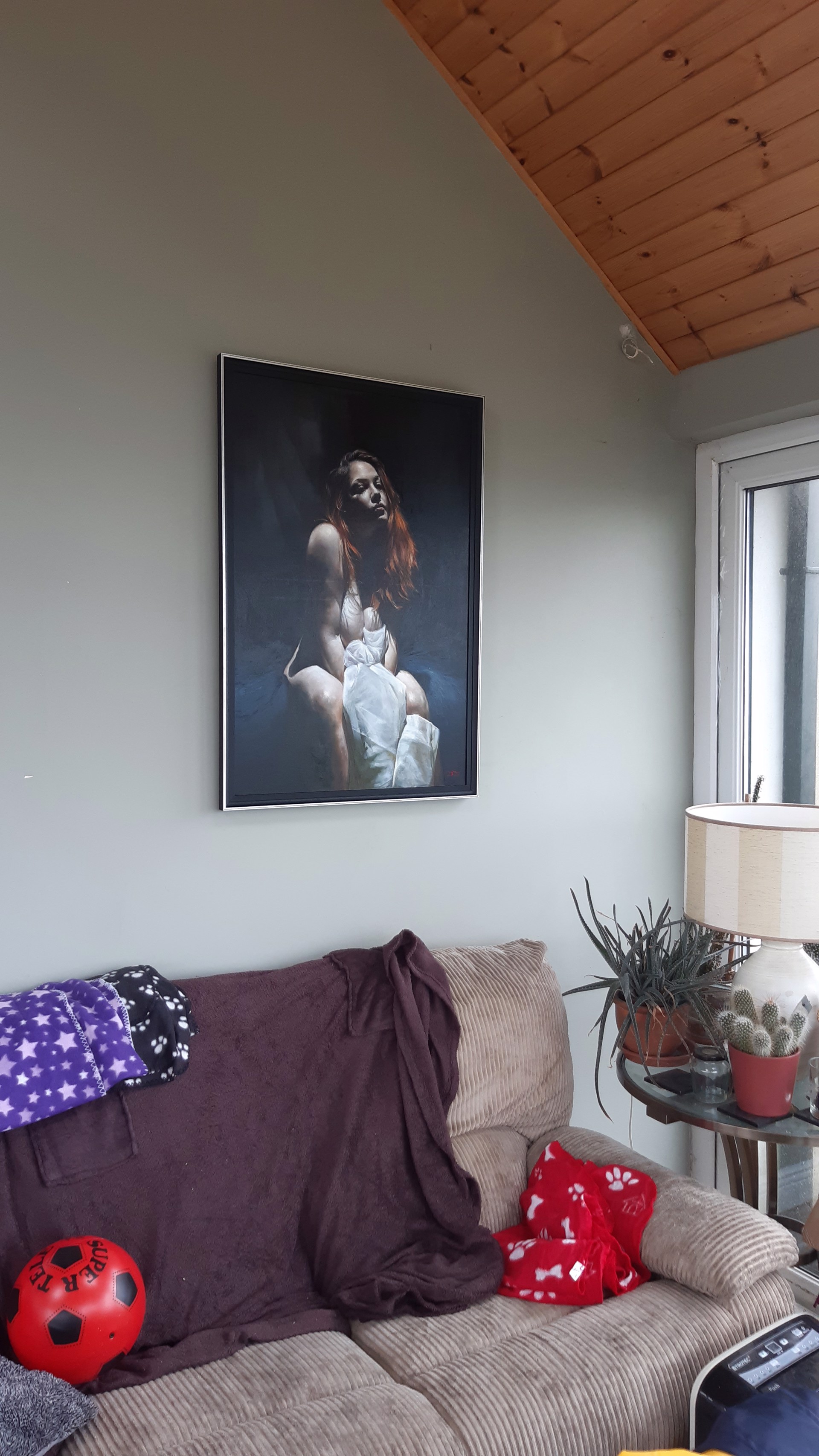 A painting of a woman sitting on a chair.
