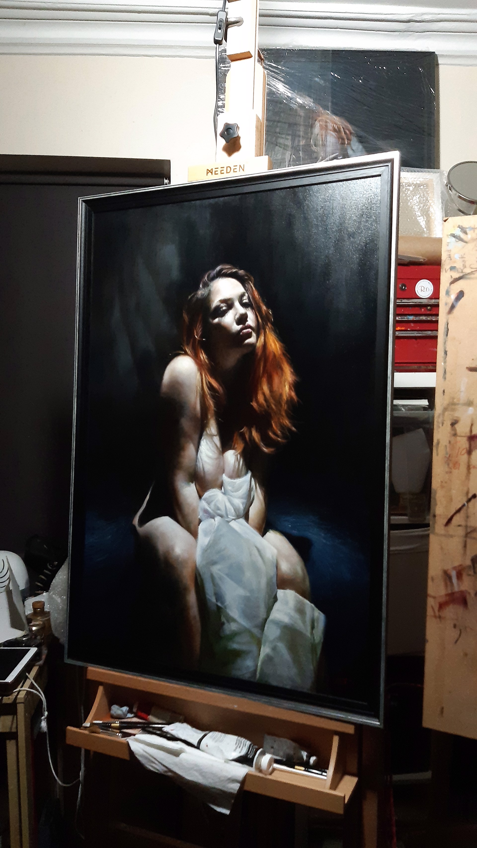A painting of a woman sitting on a chair.