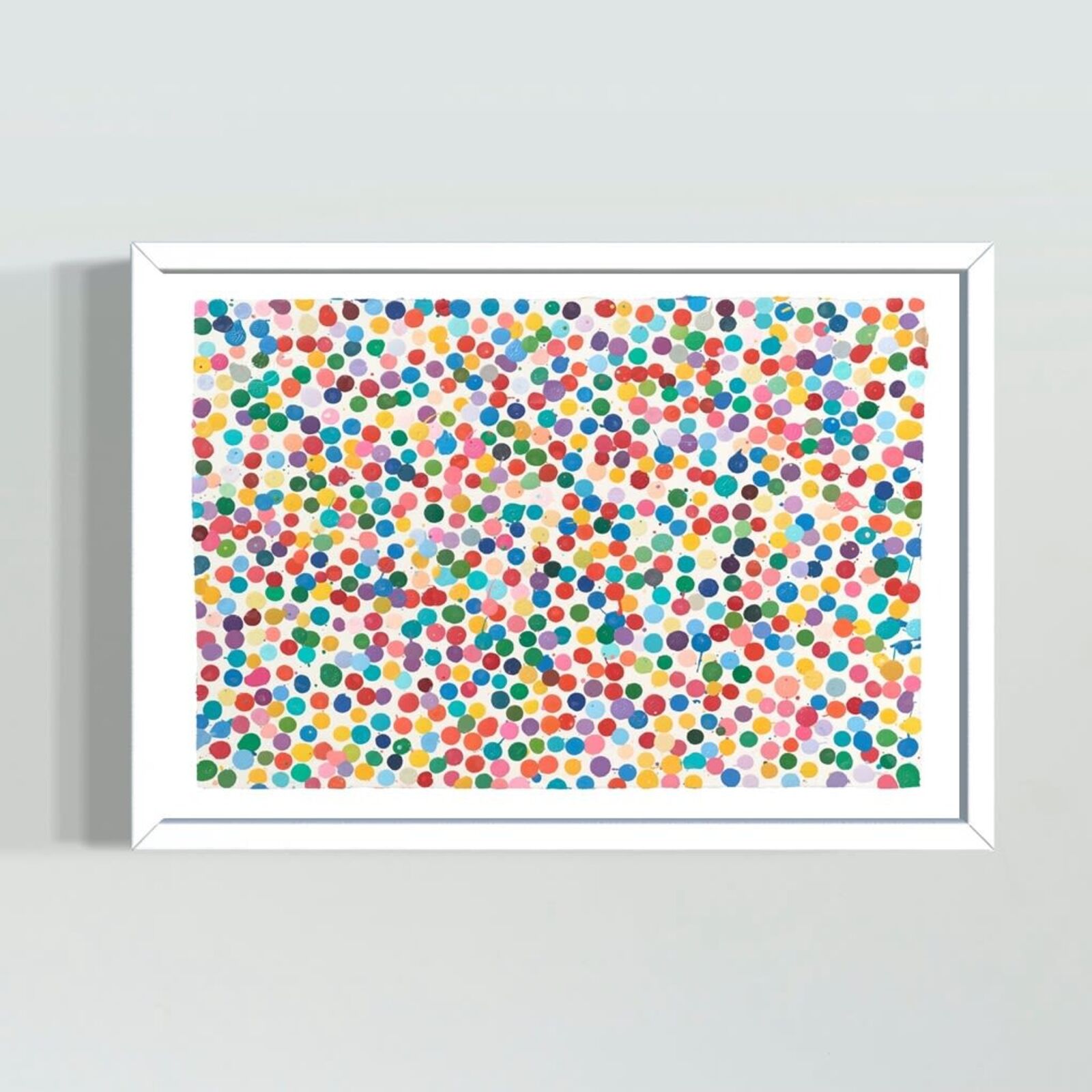 A picture of a colorful polka dot pattern on a white wall.