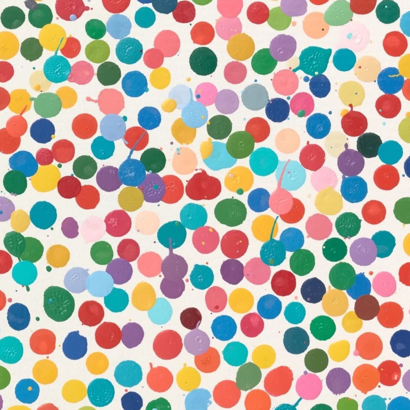 A picture of a colorful polka dot pattern on a white wall.