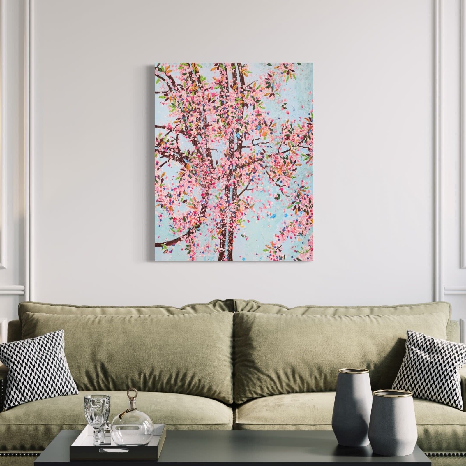 A painting of a tree with pink flowers on a blue background.