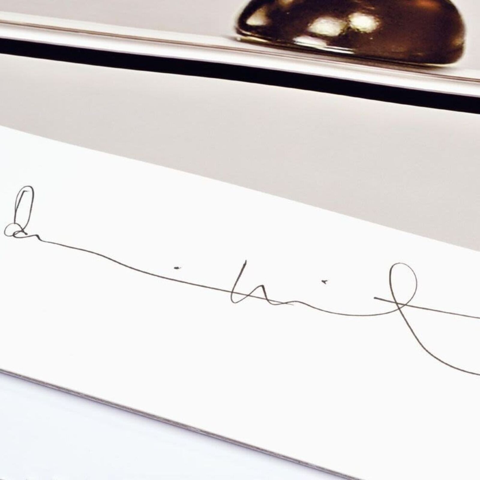 A black and white photo of pills on a shelf.