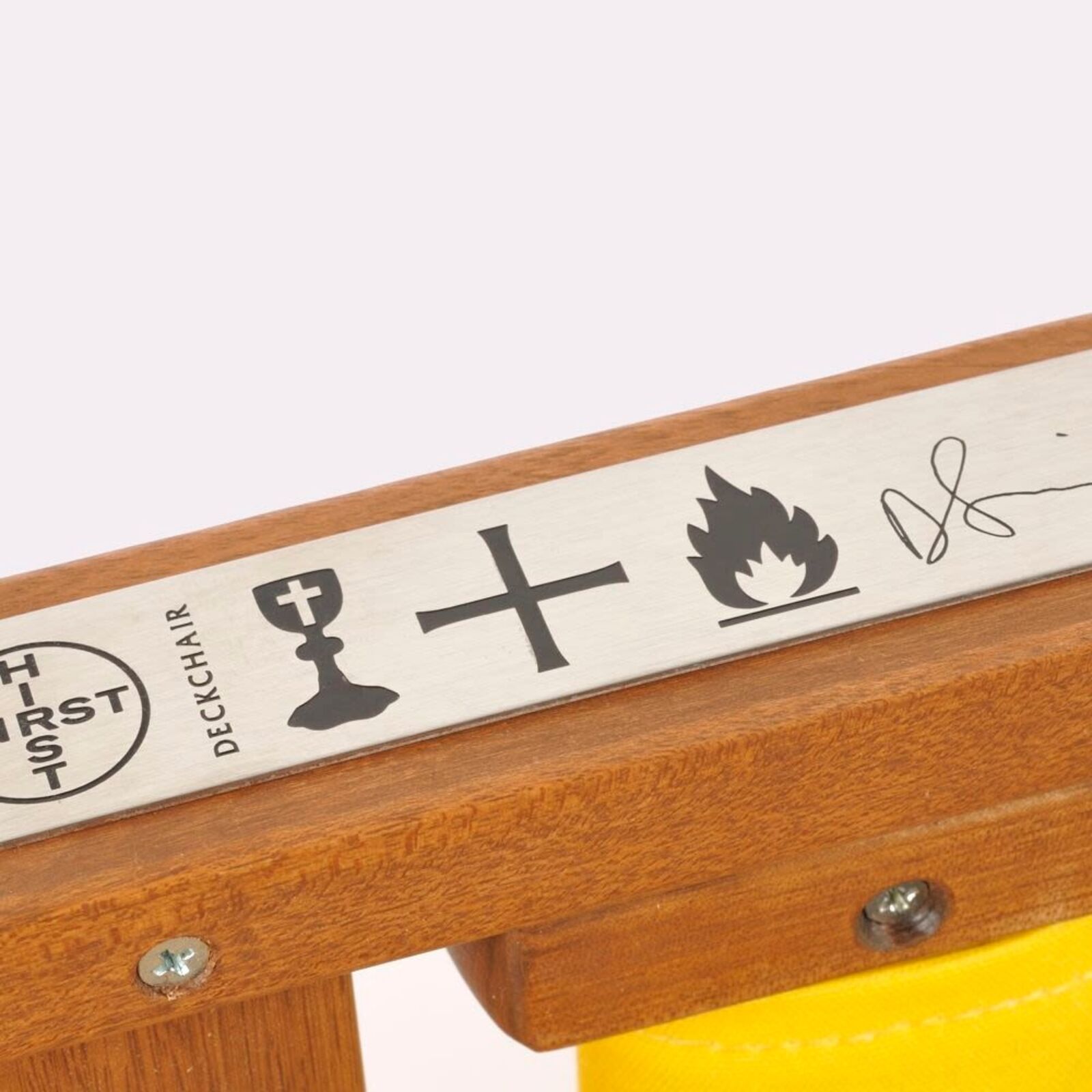 A yellow deck chair with butterflies on it.