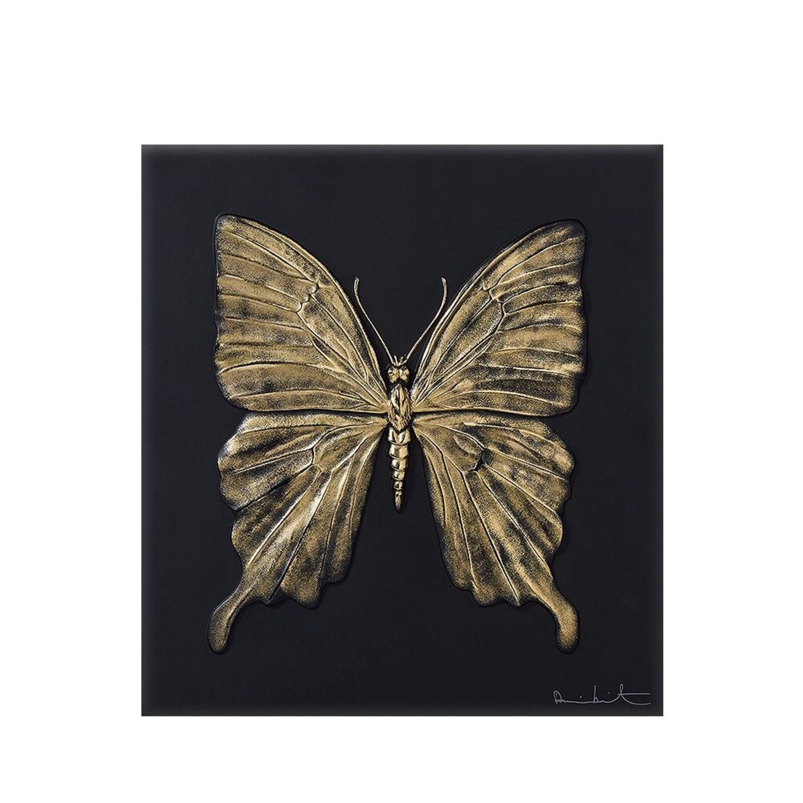 A gold butterfly on a black background. 