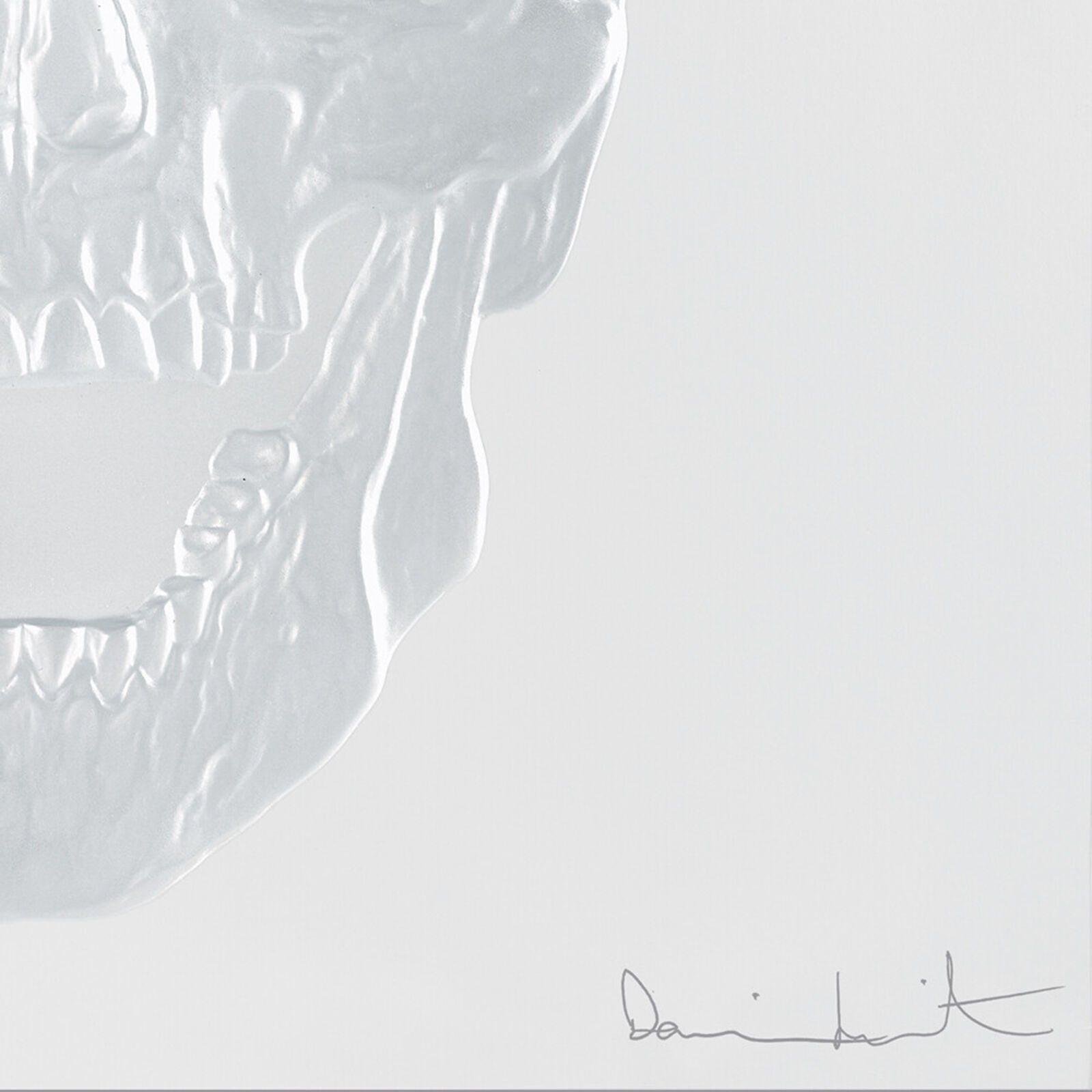 A white skull with a gold crown on its head.