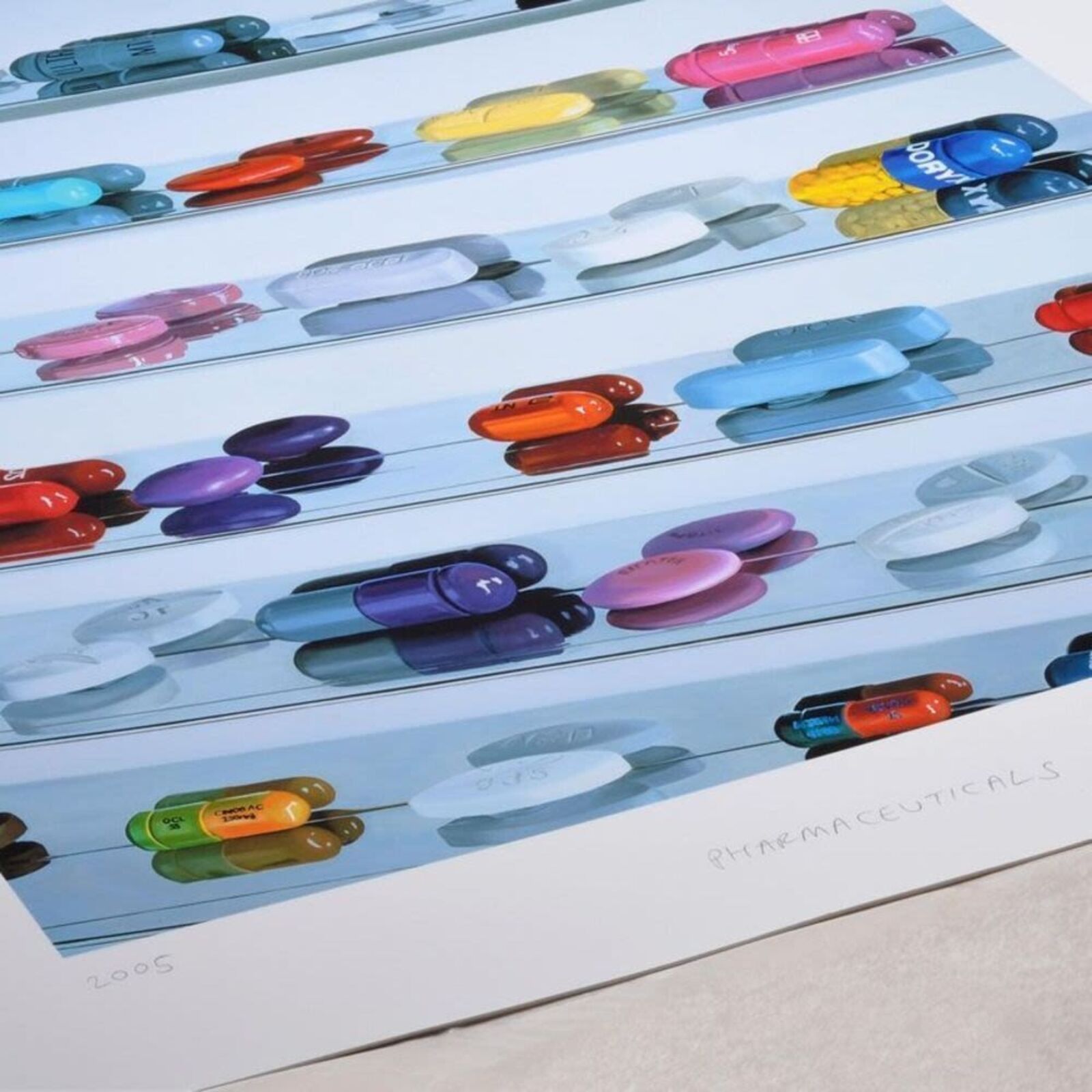 A picture of a shelf filled with lots of different colored pills.