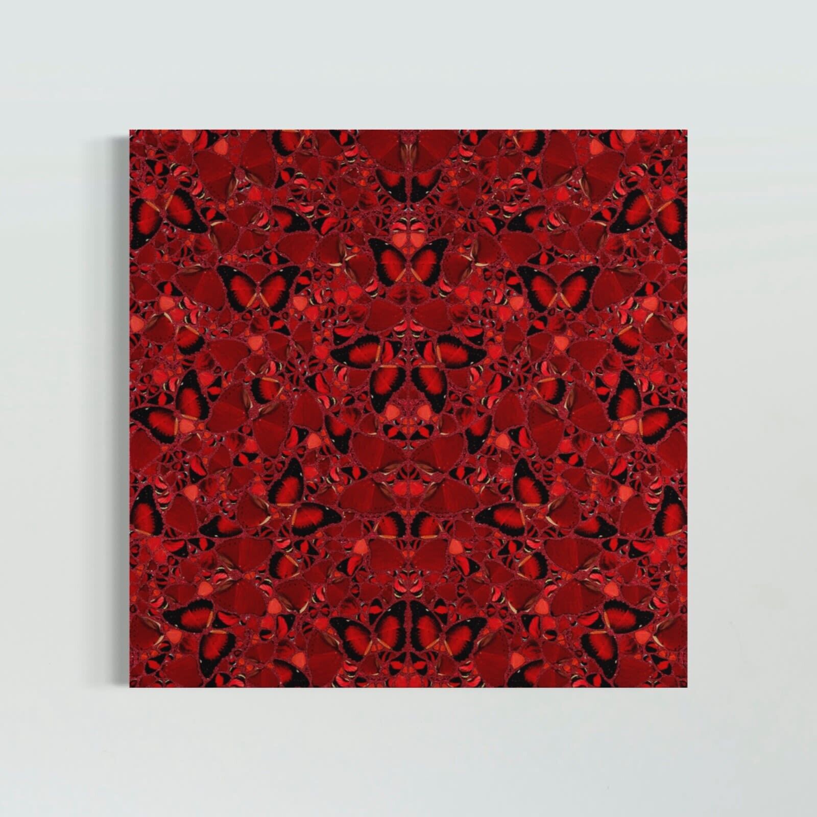 A wooden bench sitting in front of three red paintings on a white wall.