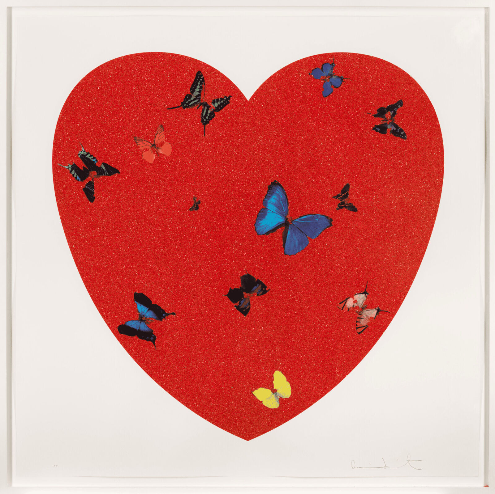 A red heart with butterflies flying around it.