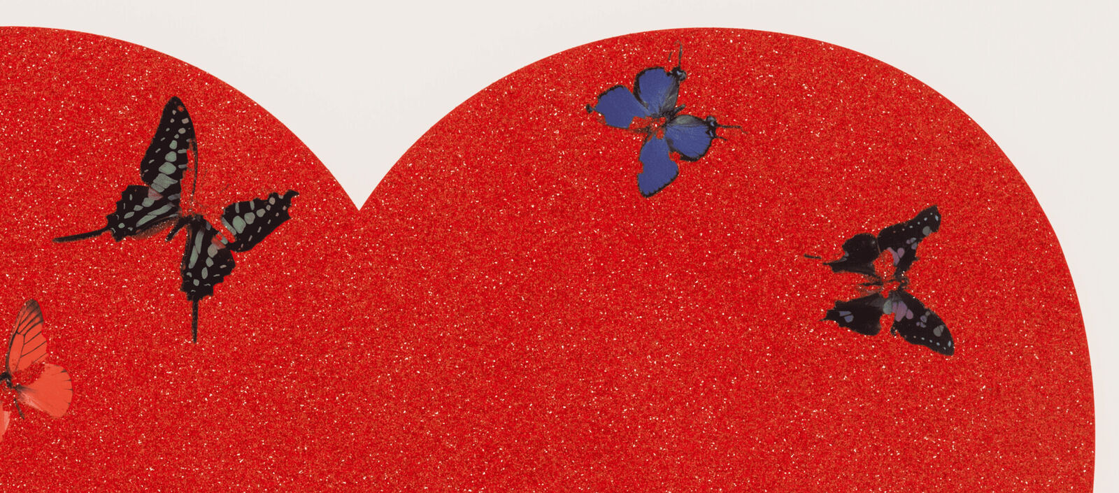 A red heart with butterflies flying around it.