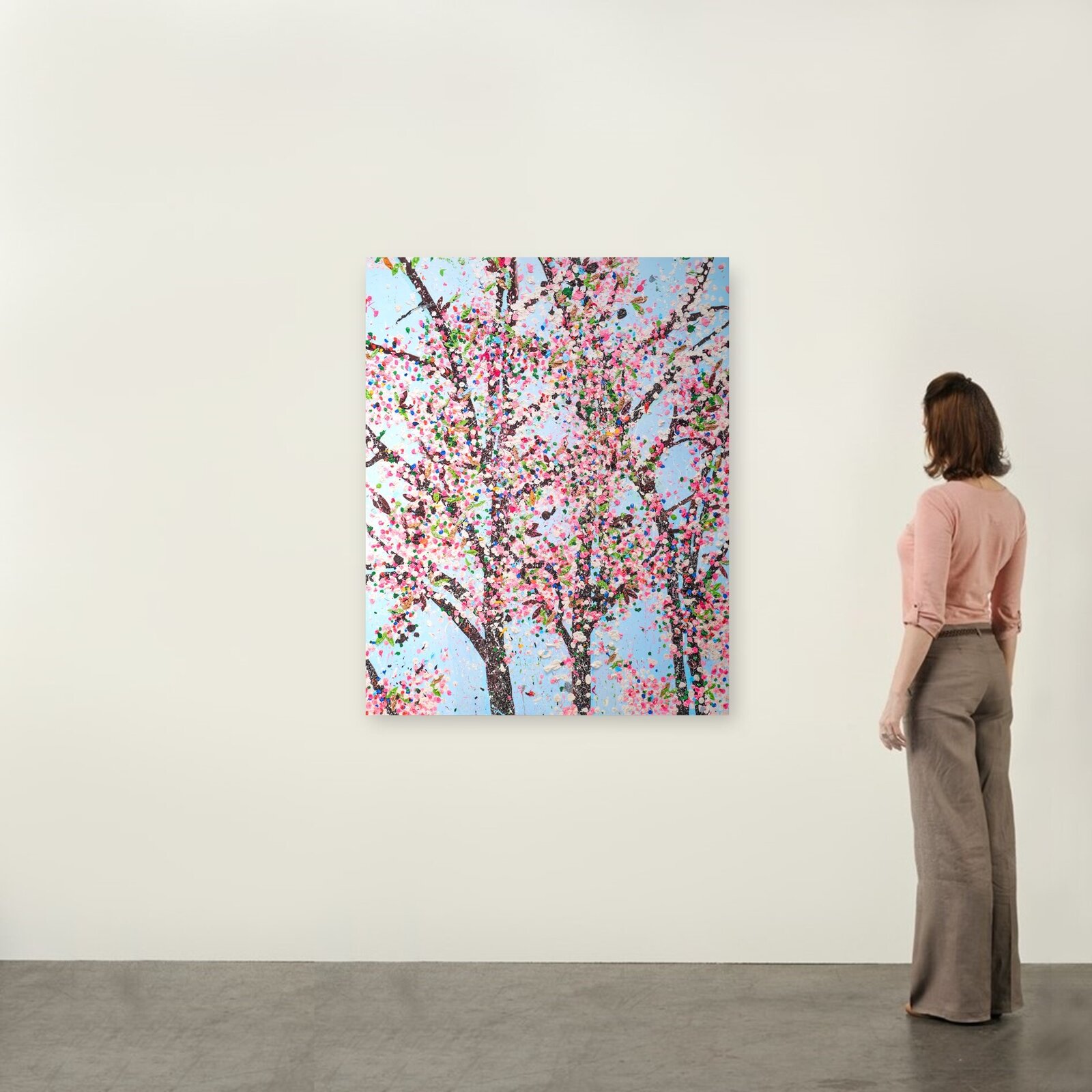 A colorful, textured painting of blooming trees against a light blue sky.