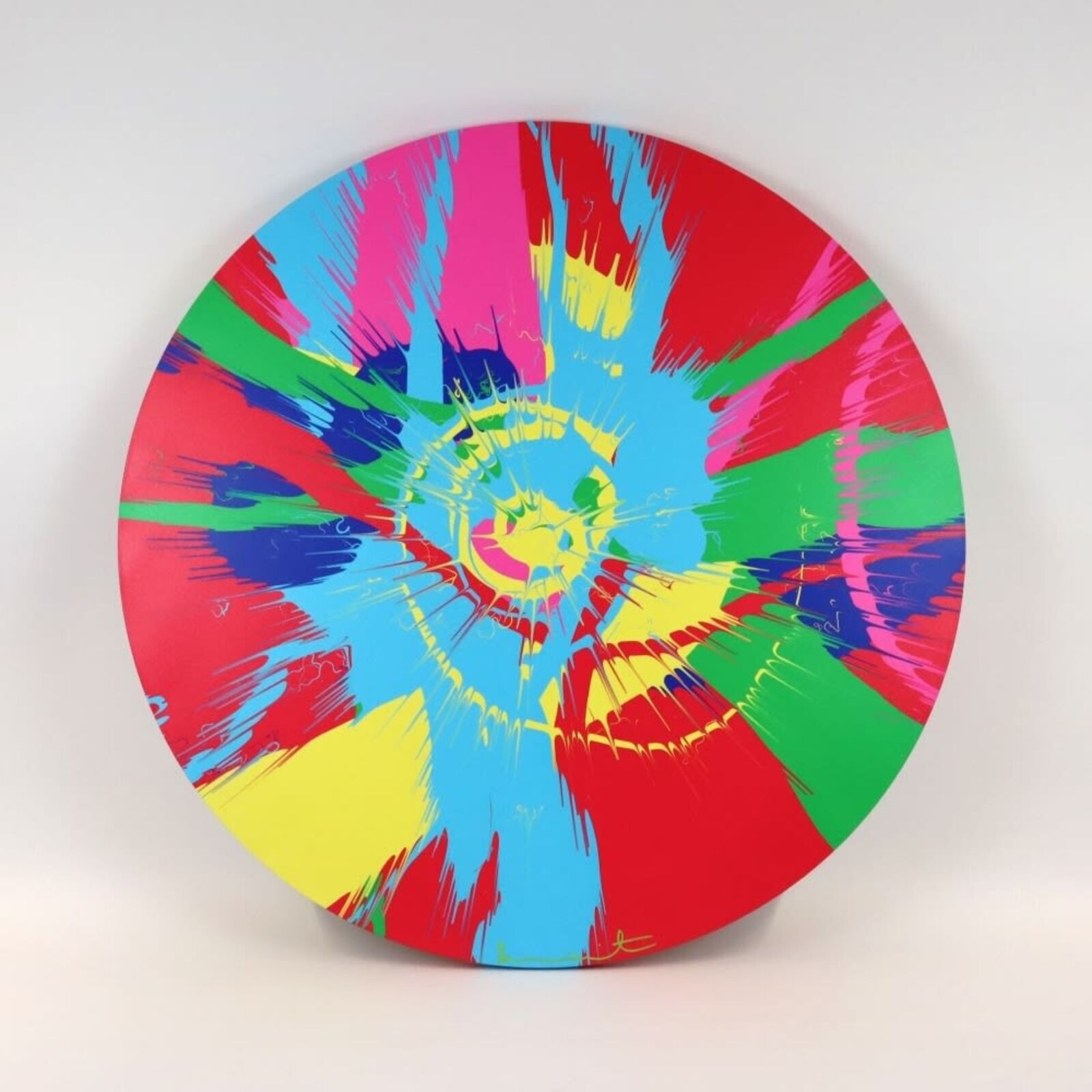 A colorful plate with a colorful design on it.