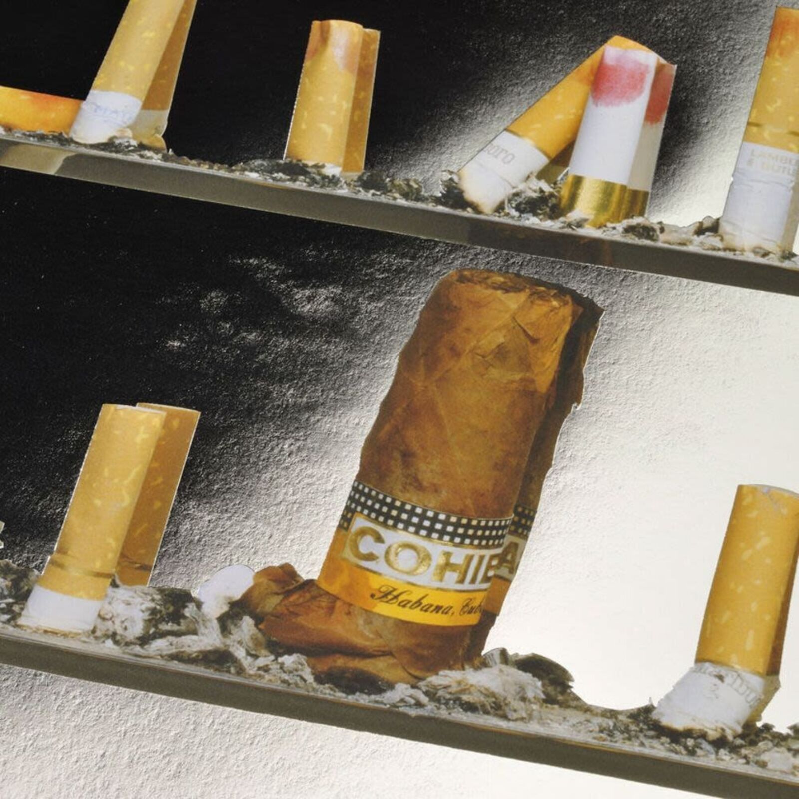 A picture of a shelf of cigarettes on a wall.