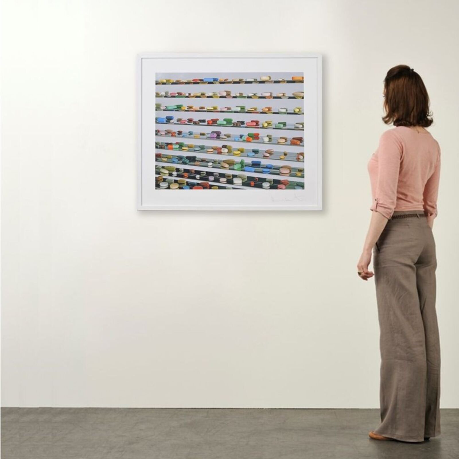 A picture of a white frame hanging on a wall.