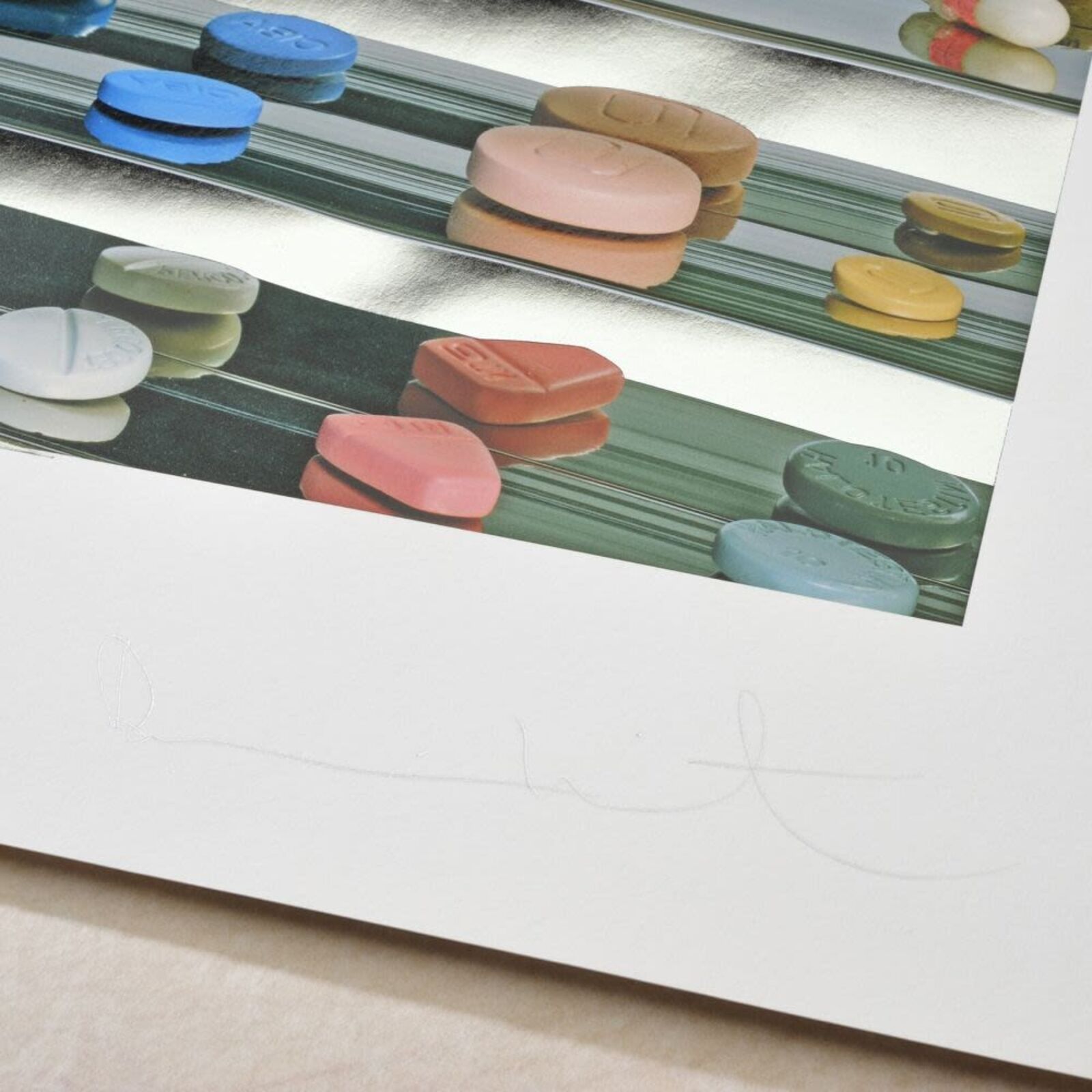 A picture of a white frame hanging on a wall.