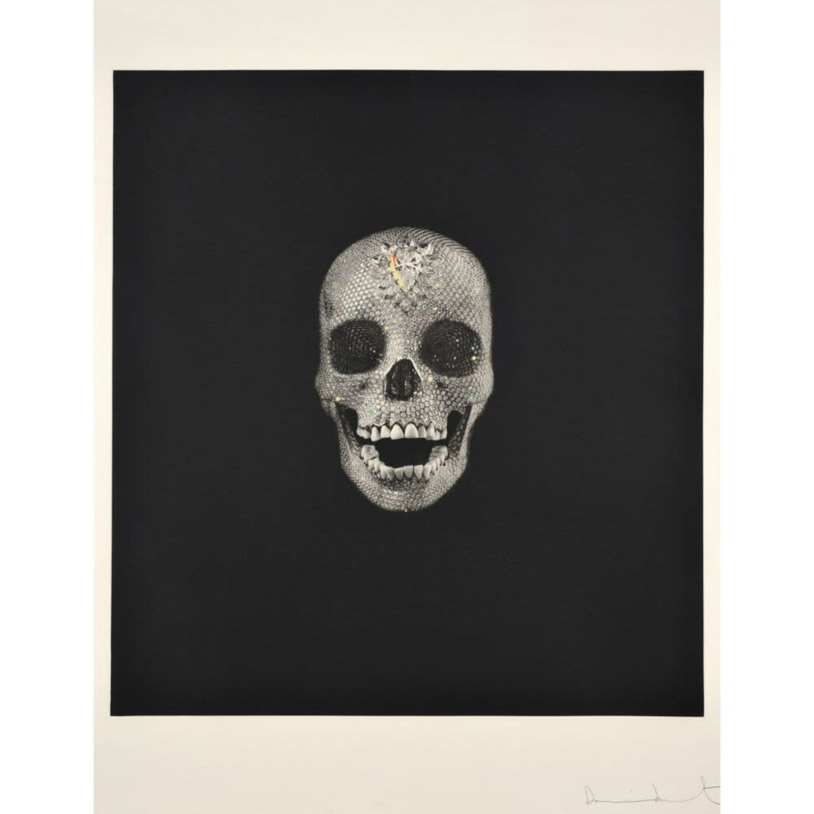 A black and white drawing of a skull on a wall.