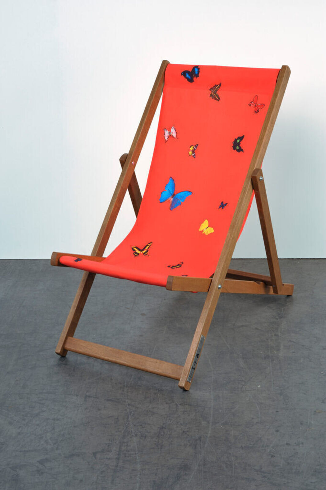 Artwork by Damien Hirst, Deck chair (Red), Made of Merpauh timber frame and sail cloth fabric 