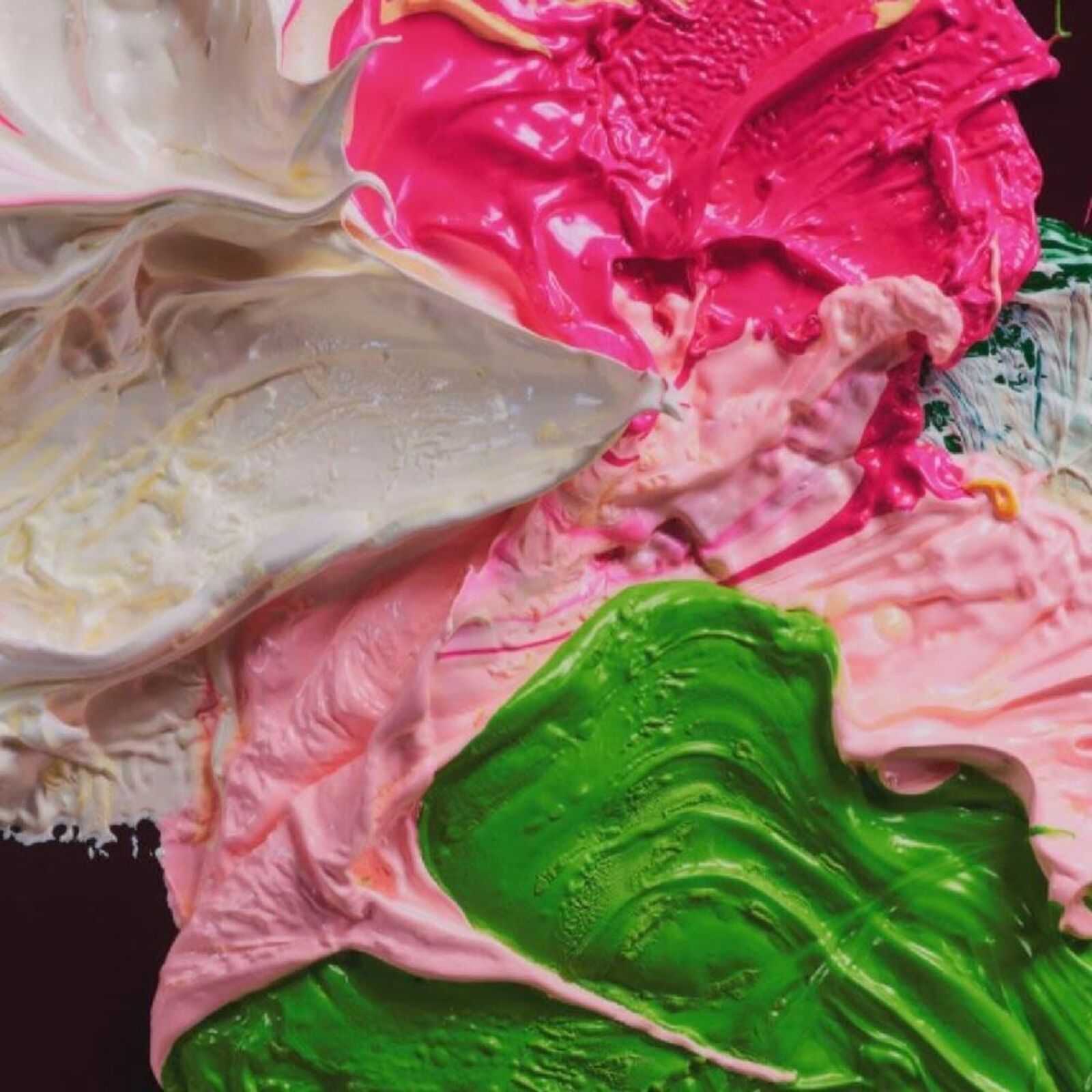 A vibrant abstract composition of thick, textured paint in bold colors.