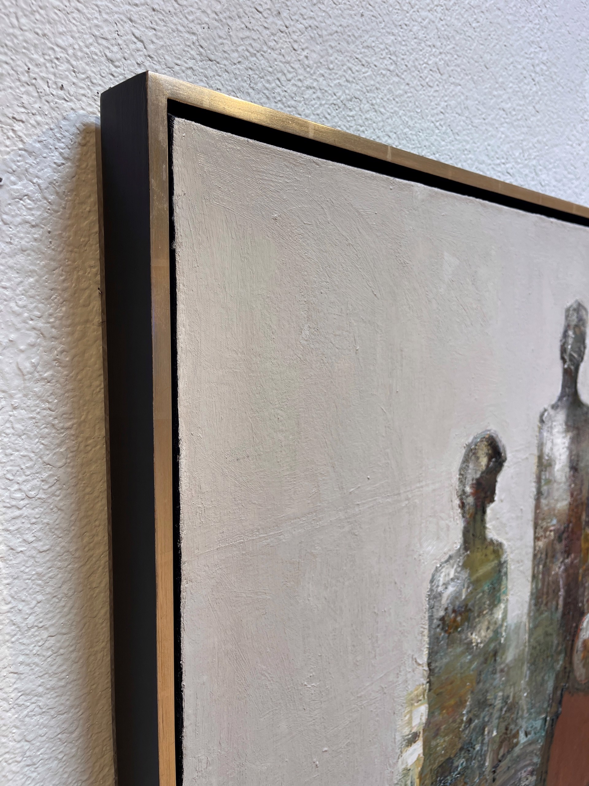 A painting of two people sitting on a couch.