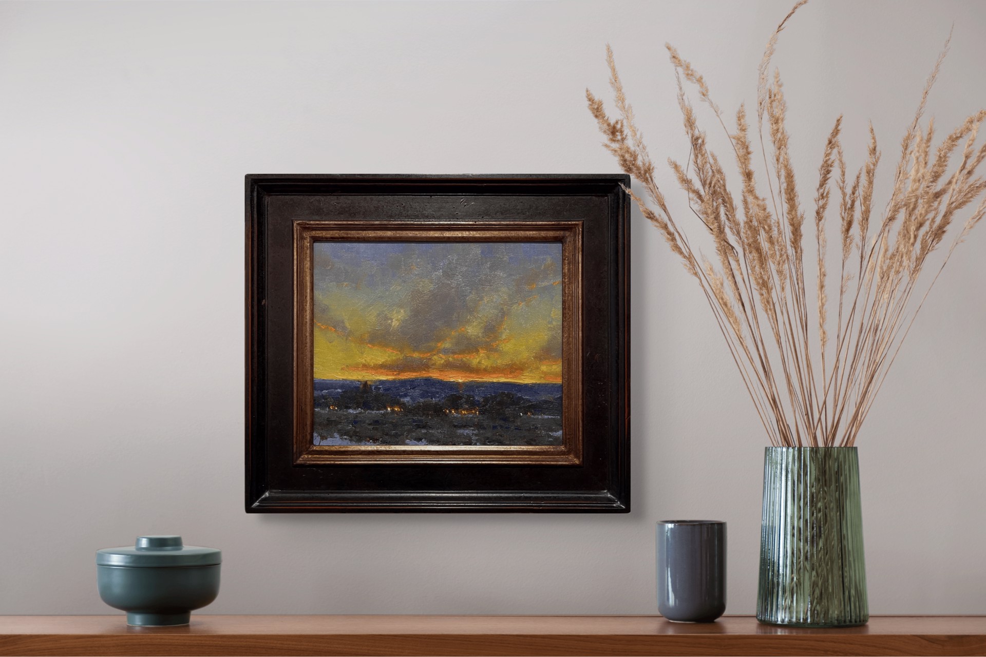 A dramatic landscape painting capturing a twilight sky over a dark, snowy foreground.
