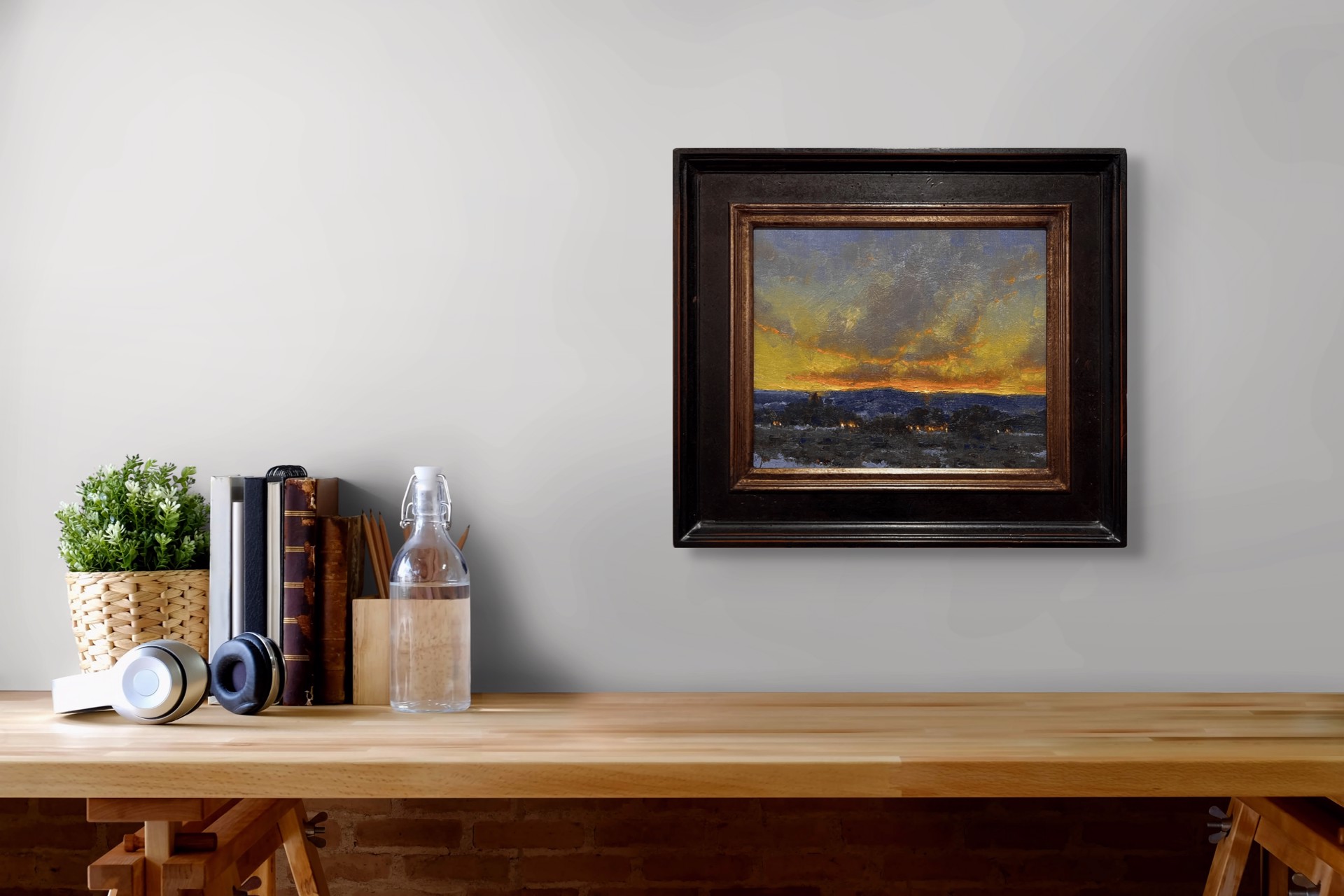 A dramatic landscape painting capturing a twilight sky over a dark, snowy foreground.