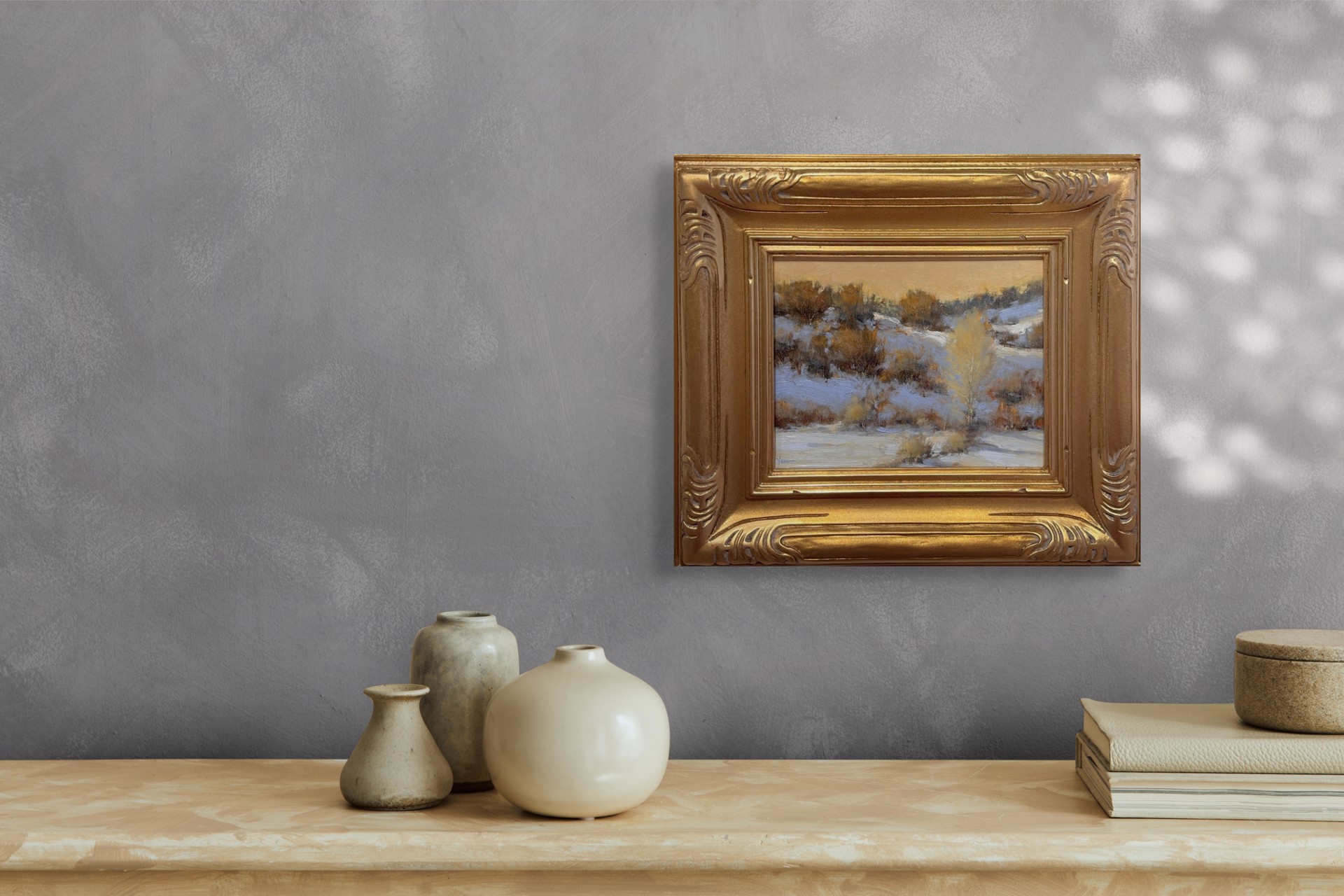 A winter landscape painting capturing a snowy hillside under a warm, golden sky.