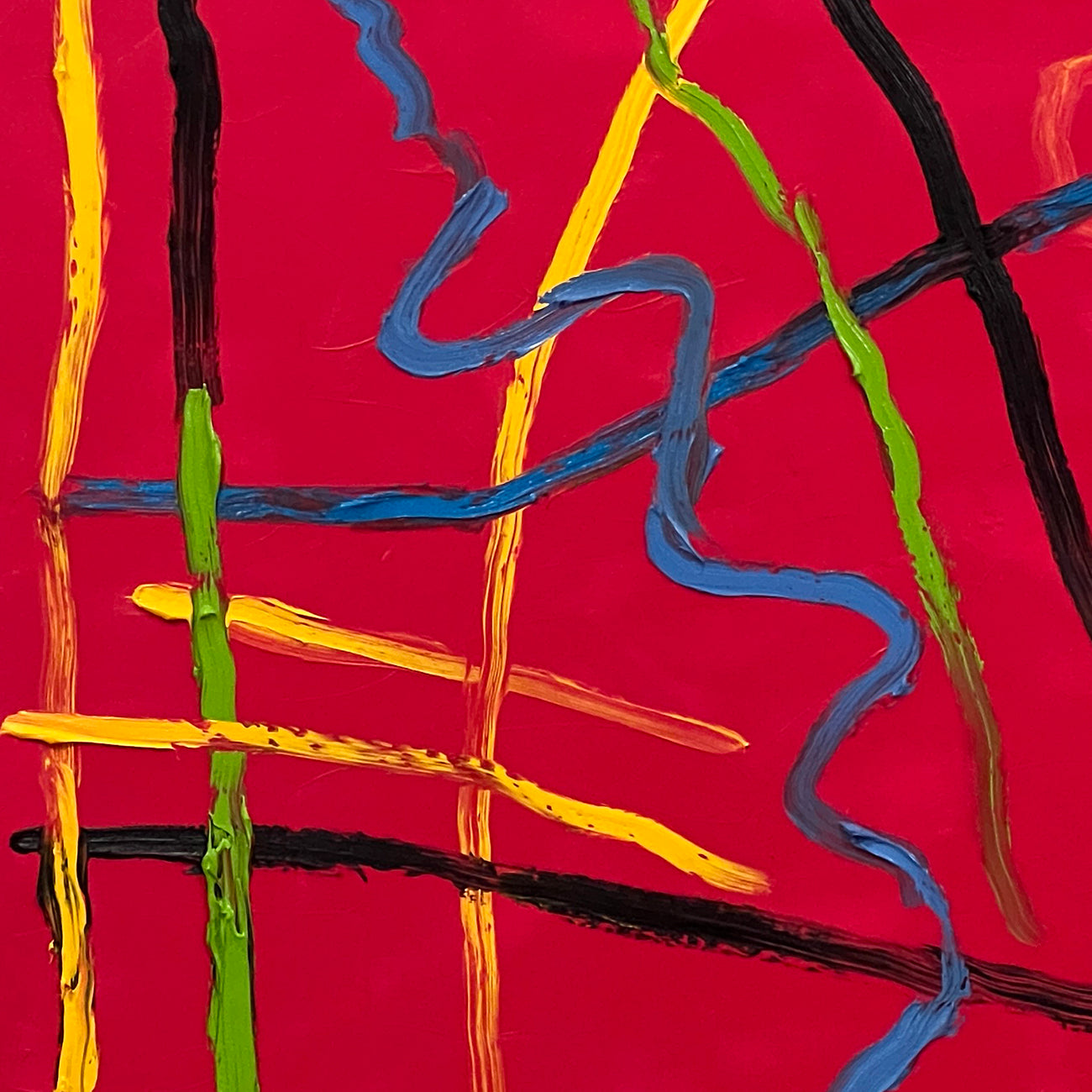 A red painting with blue, yellow, and red lines on it.