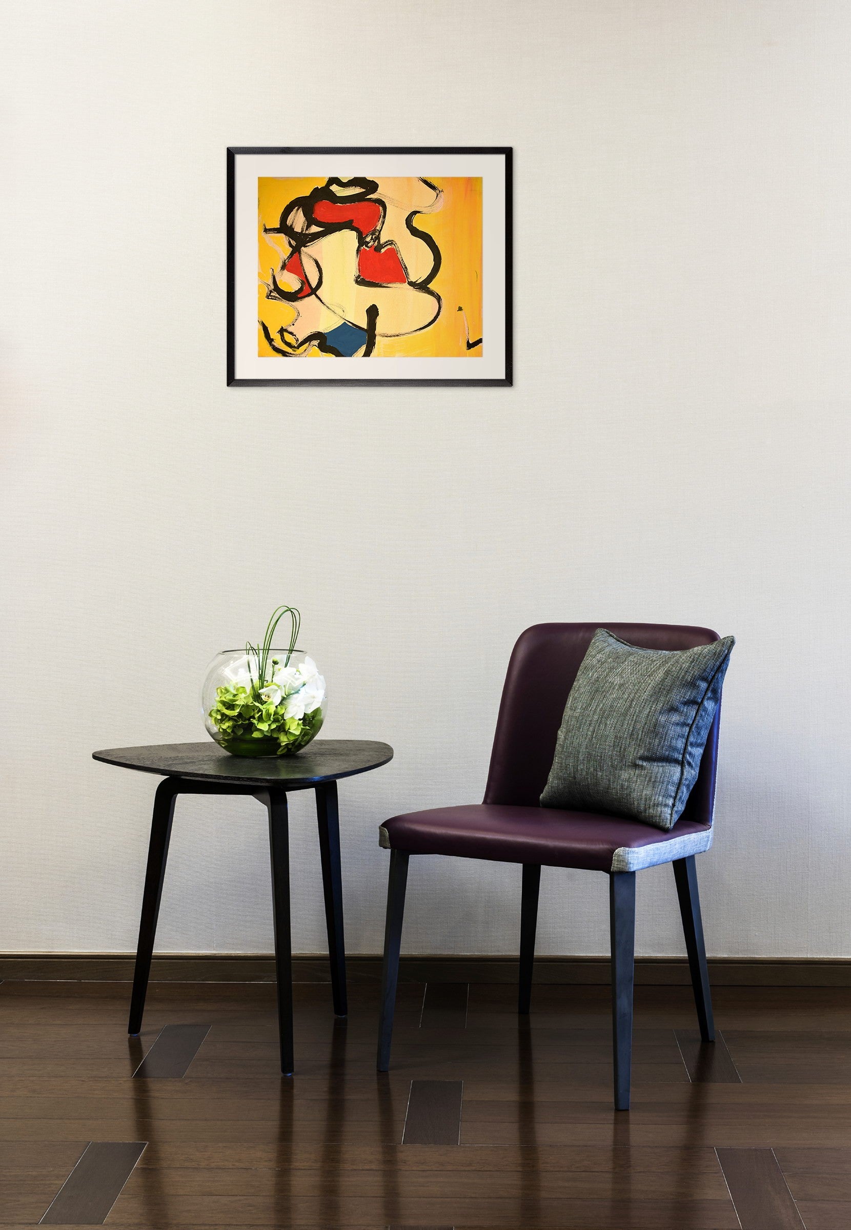 A painting of a yellow background with red, black, and blue shapes.