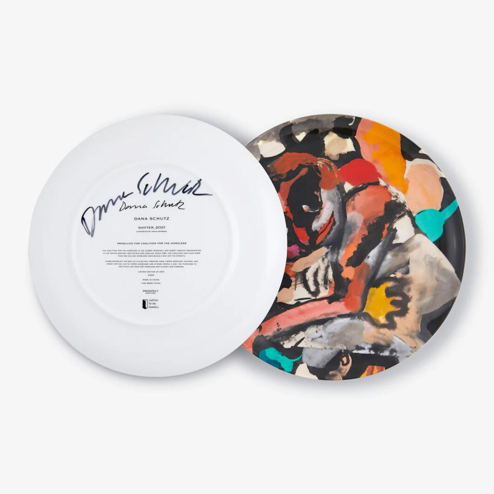 A plate with a painting of a woman's face on it.