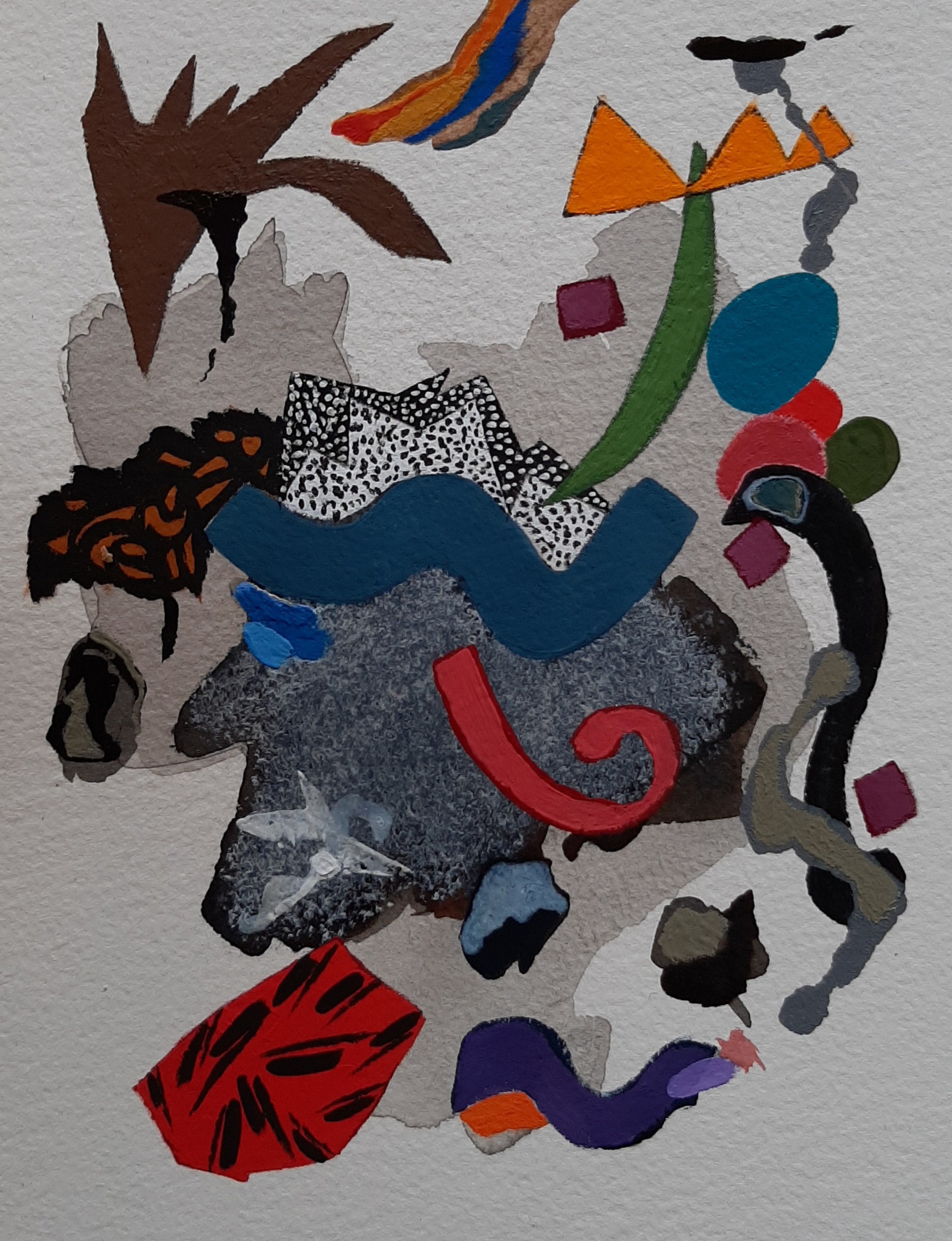 A collage of various shapes and colors on a white surface.