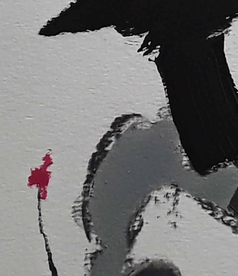 A black and white painting with a red flower in the middle.