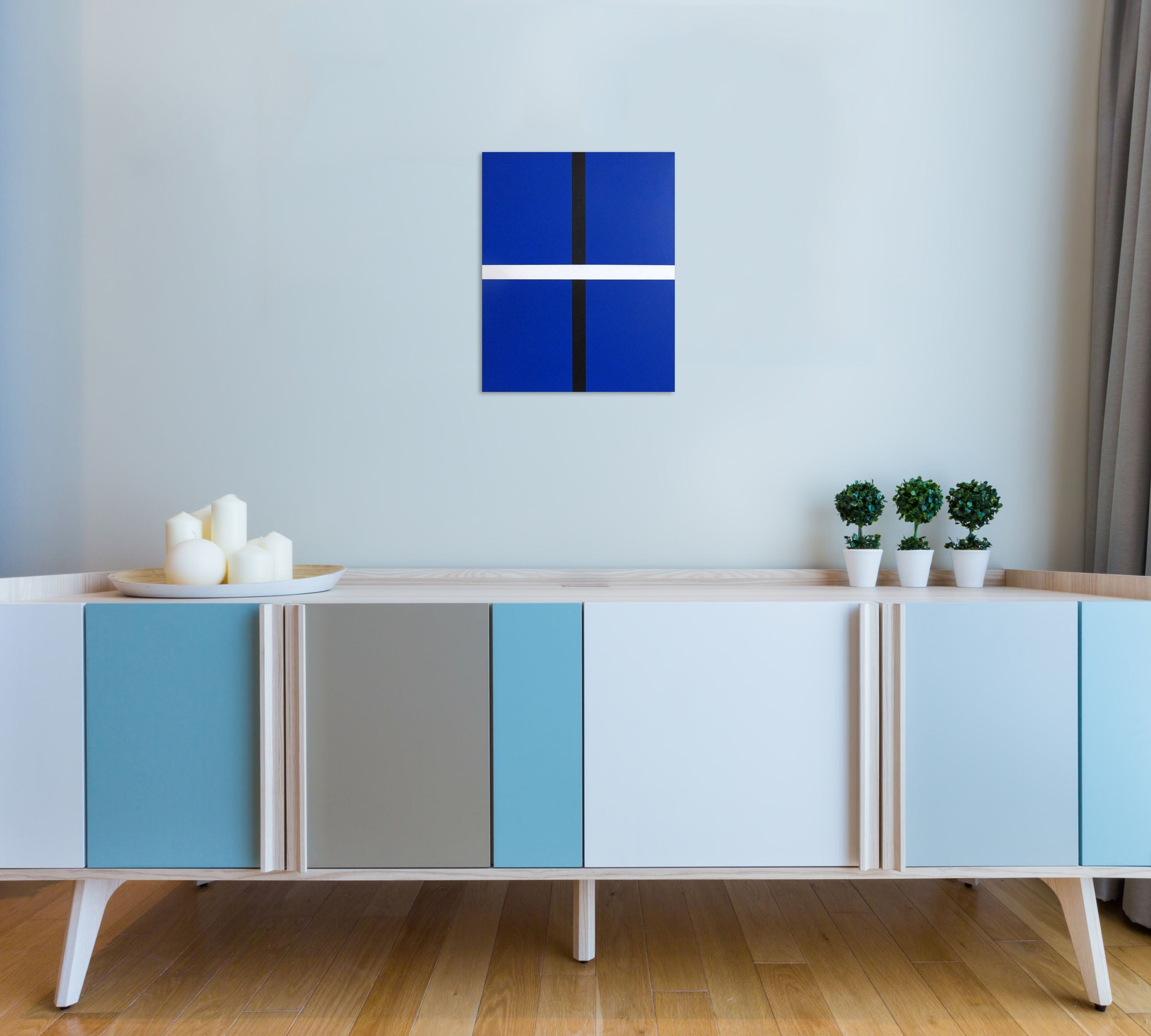 A blue and black painting with a white stripe.