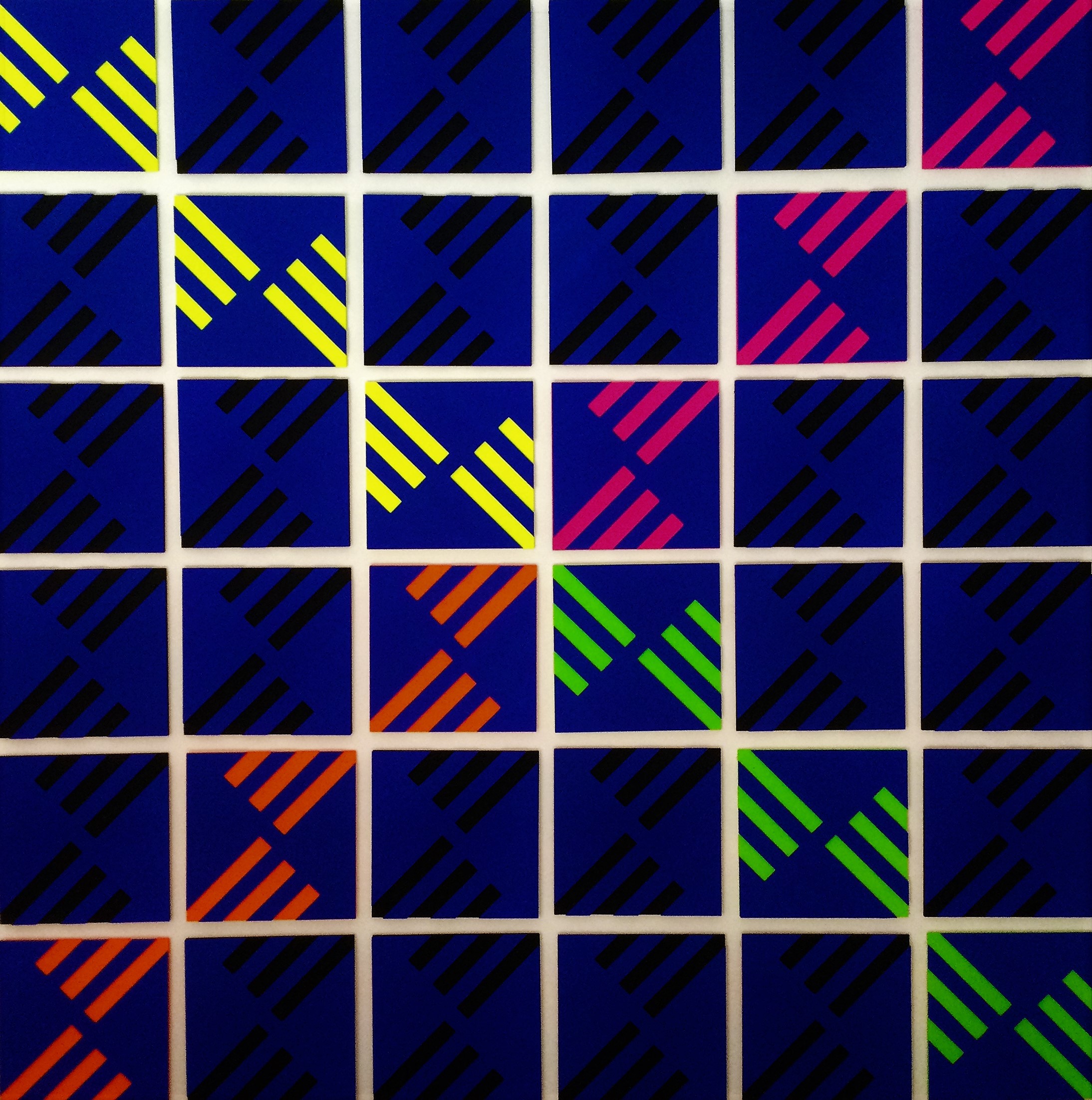 a close up of a wall with many different colored squares on it