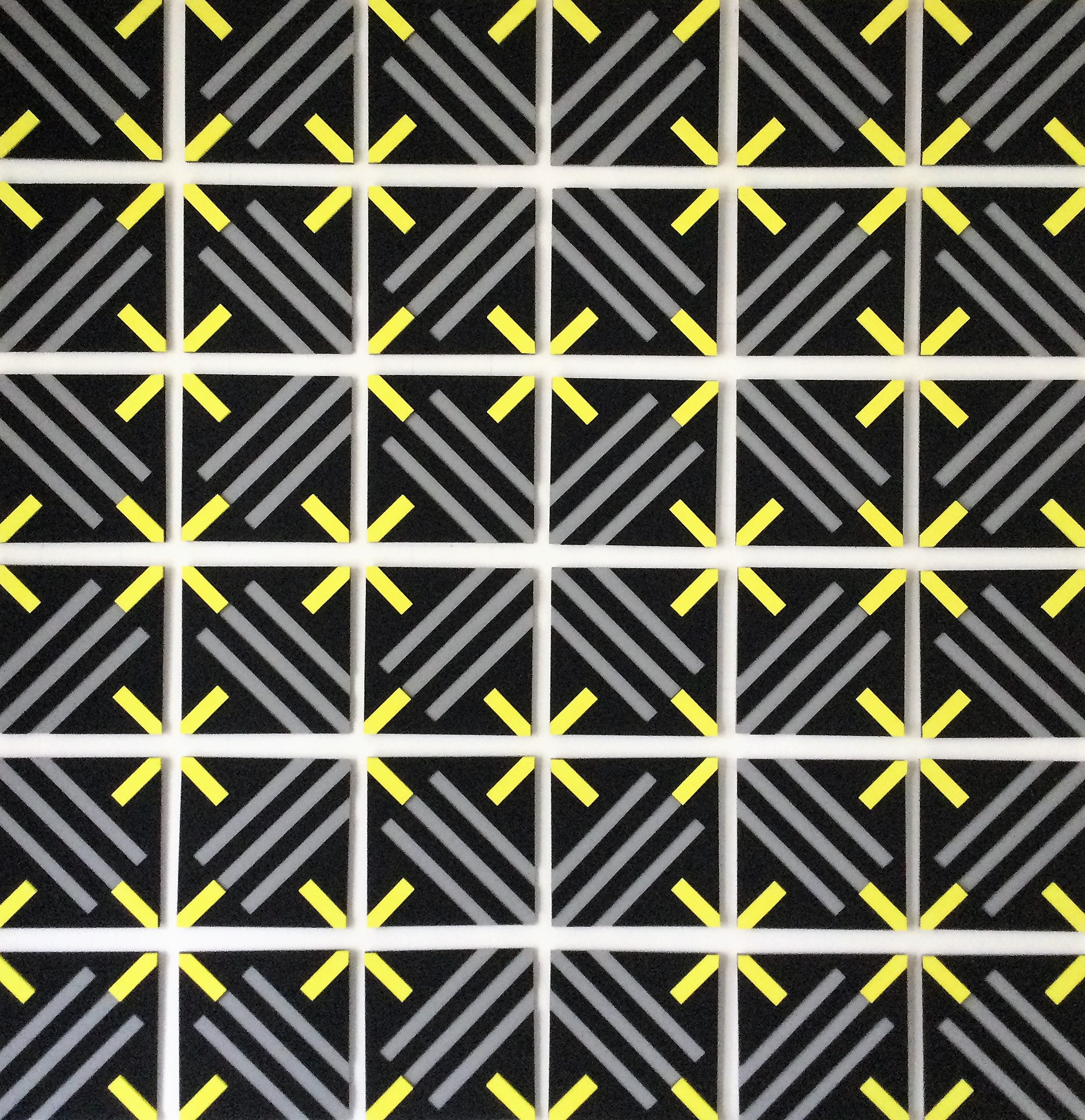 A black and yellow geometric pattern on a white background.