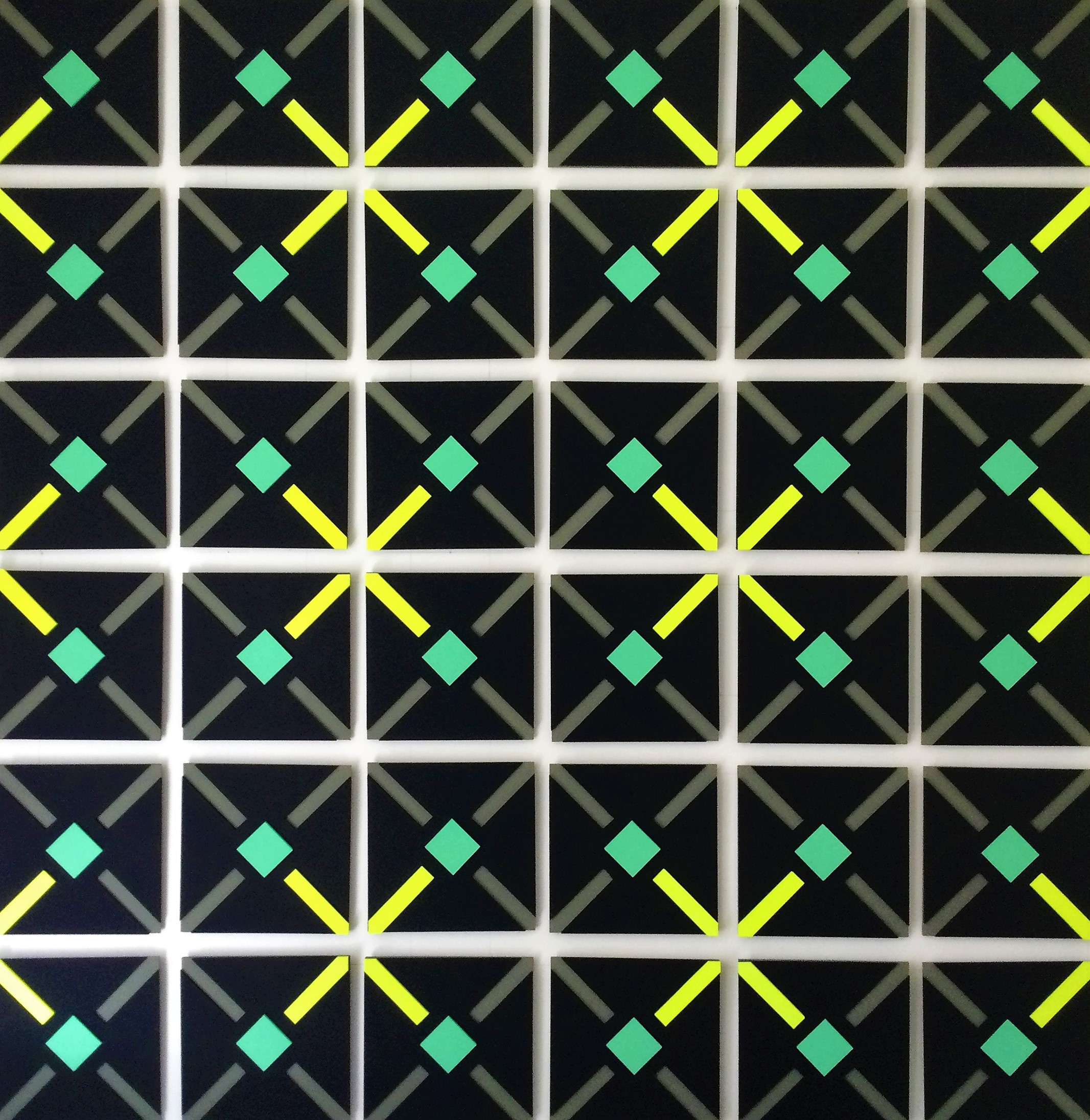 A black background with green and yellow squares on it.