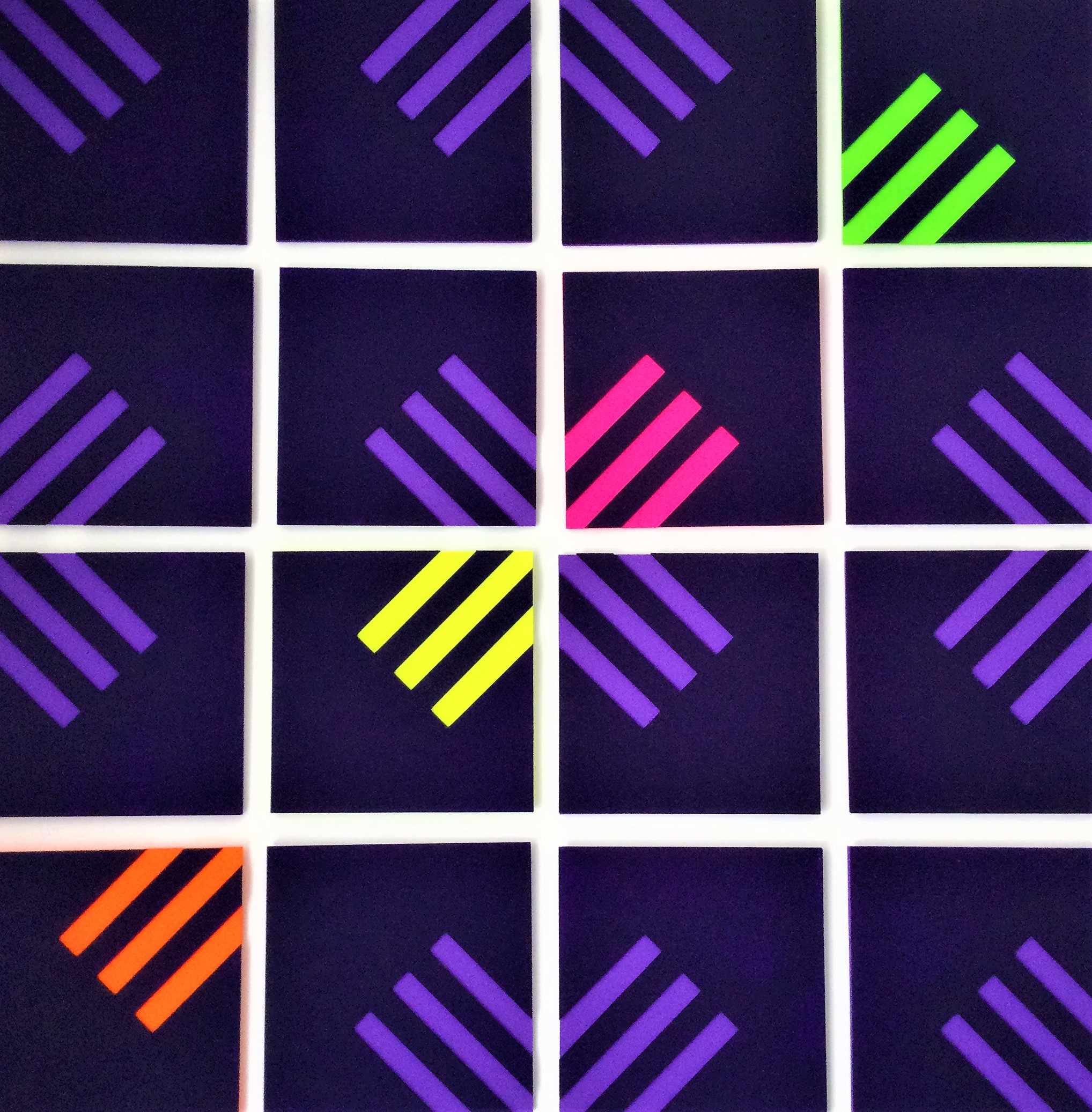 A set of nine squares with different colored lines on them.