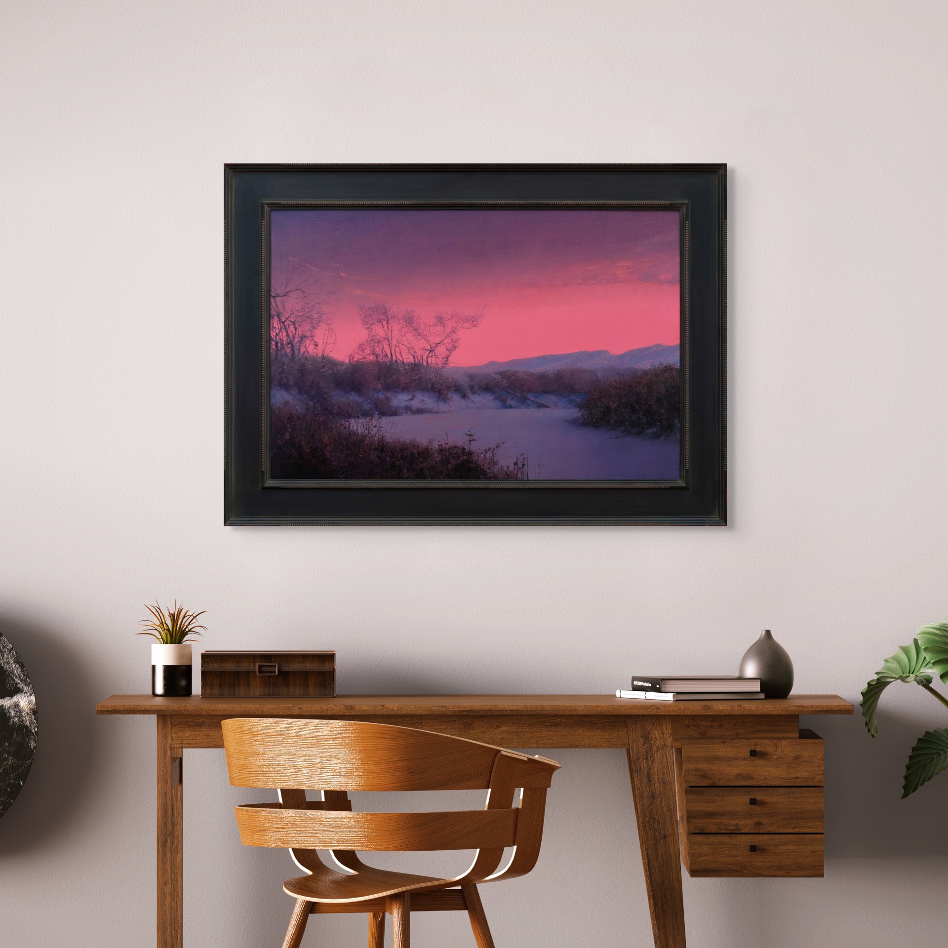 A winter landscape bathed in an intense pink and purple twilight glow.