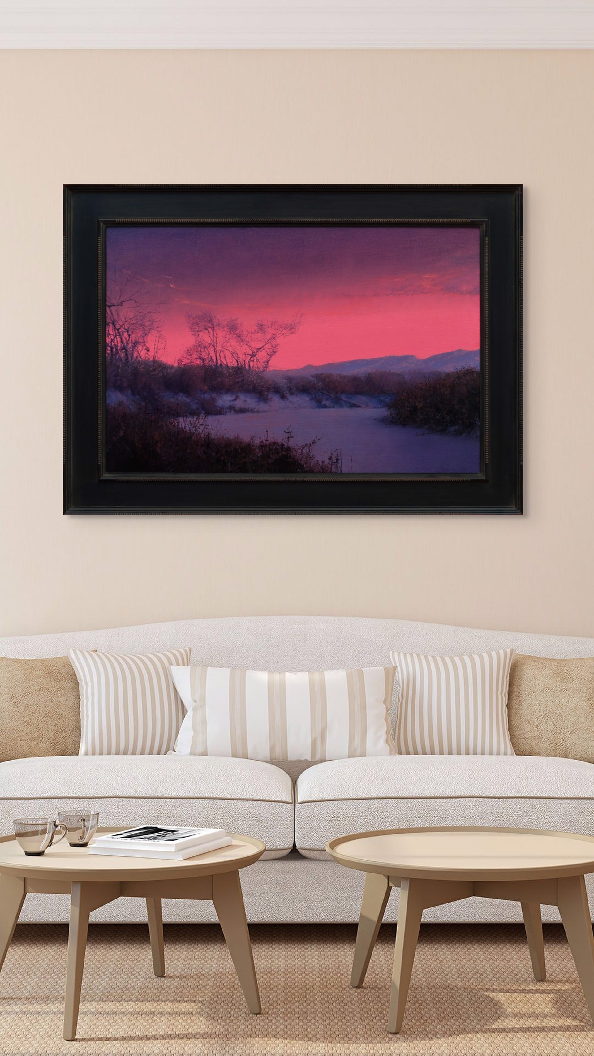 A winter landscape bathed in an intense pink and purple twilight glow.