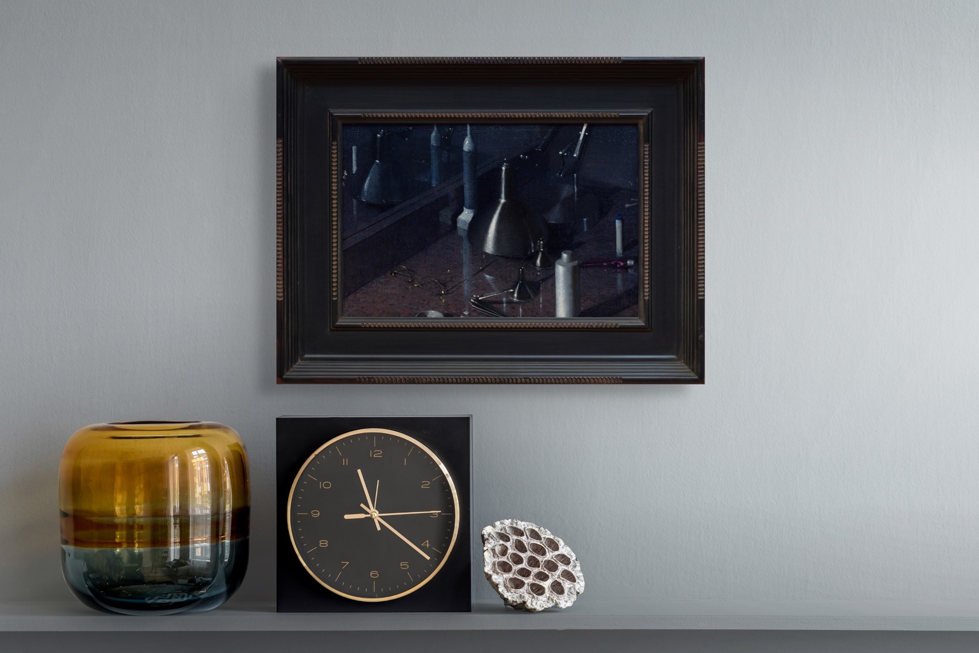 A dark, moody still life featuring metallic funnels and paint tubes on a reflective surface.