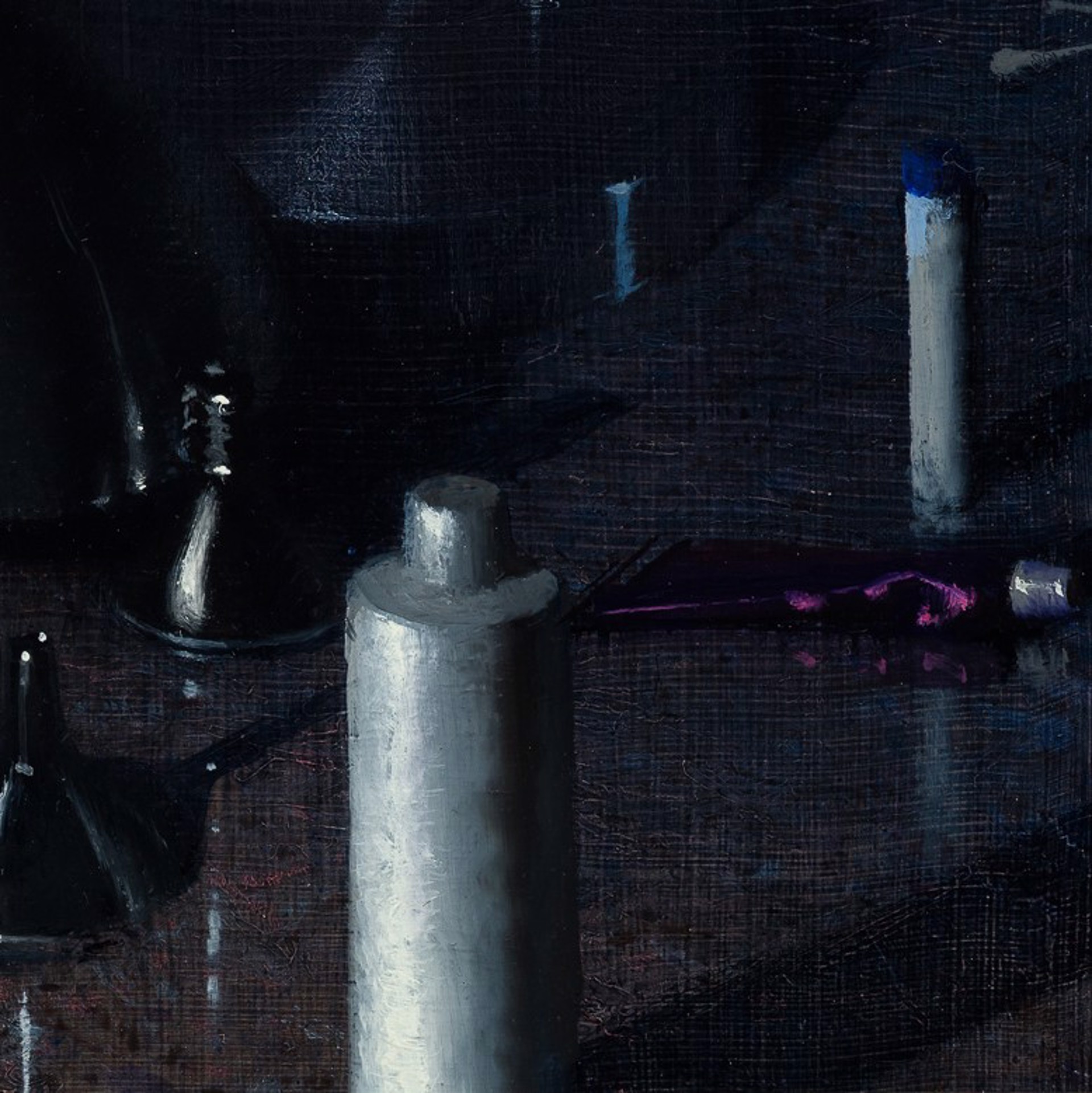 A dark, moody still life featuring metallic funnels and paint tubes on a reflective surface.