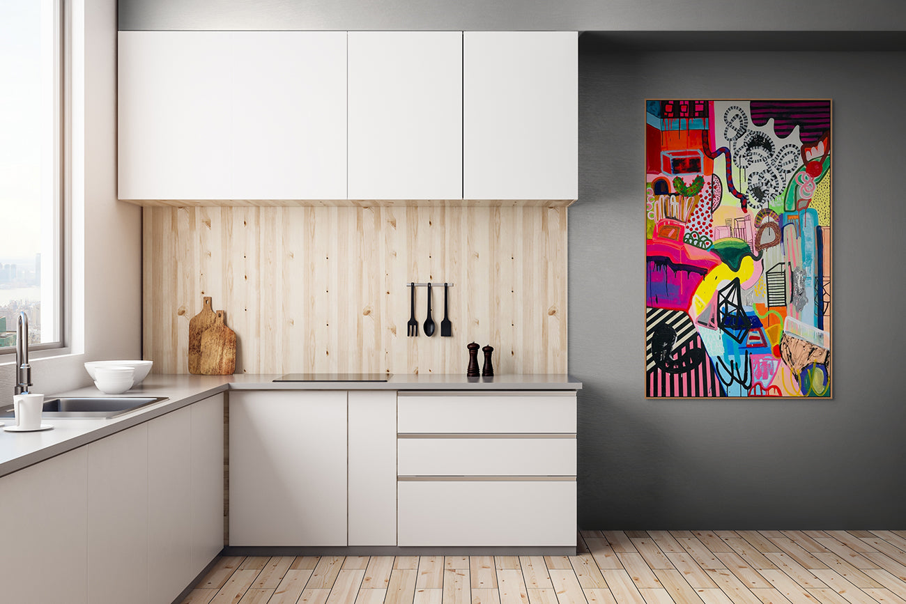 A colorful painting on a white wall in a room.