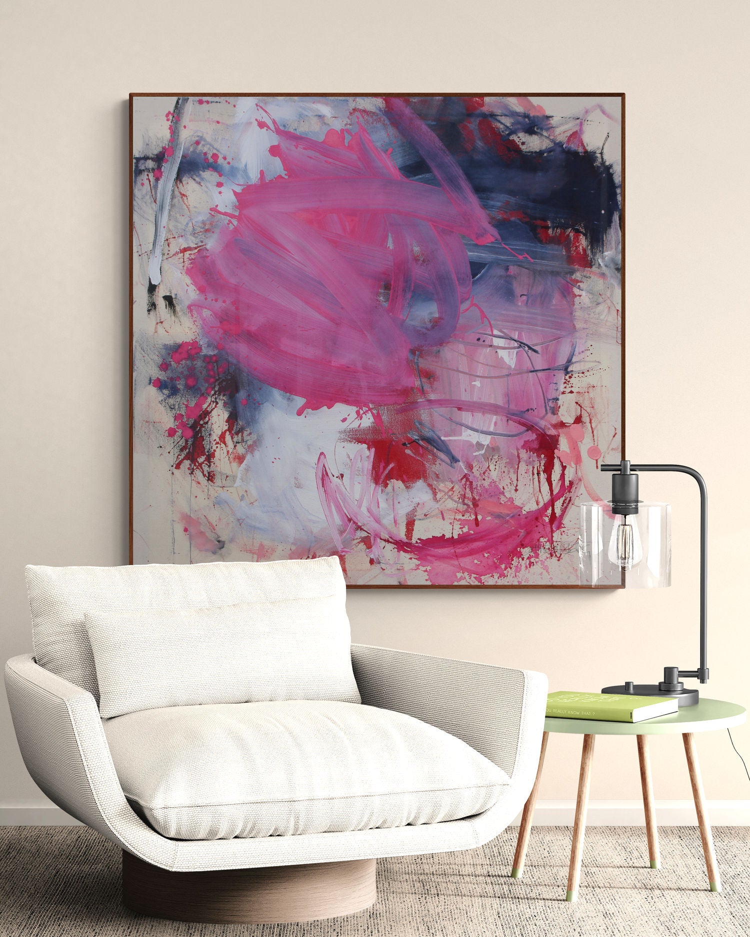 A painting with pink and blue paint splatters on a white background.