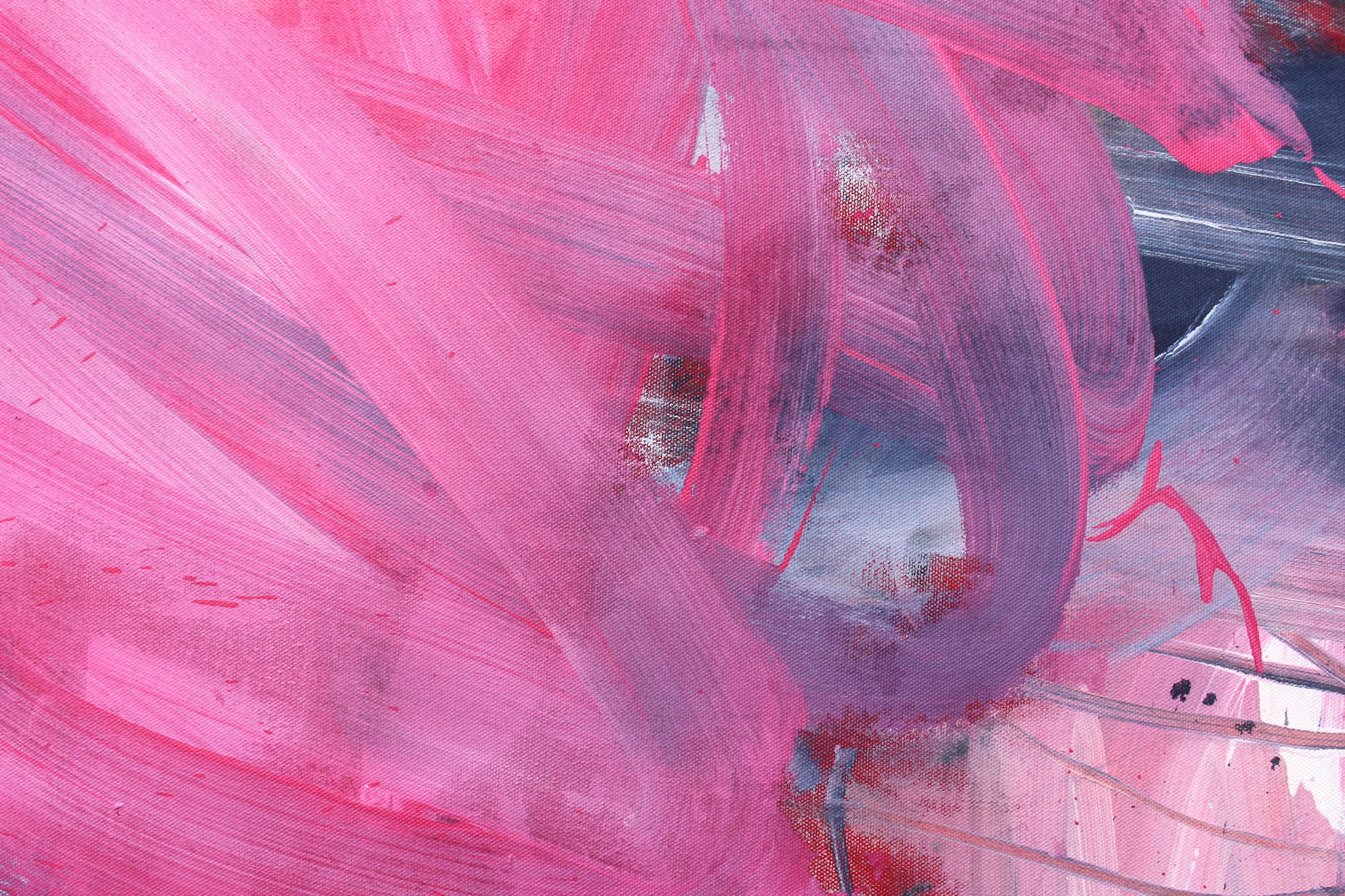 A painting with pink and blue paint splatters on a white background.