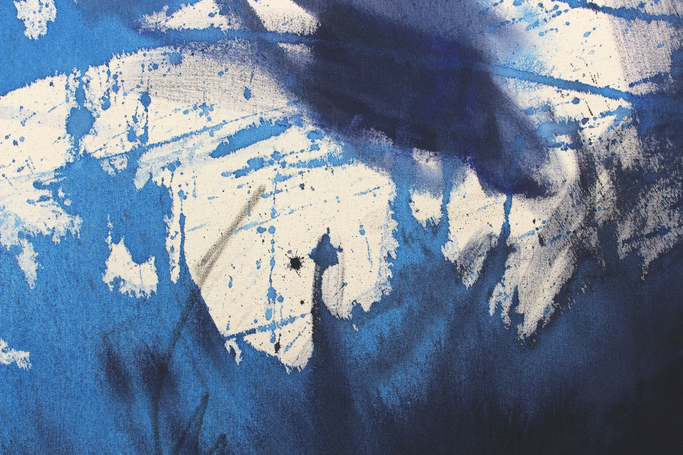 A blue and white painting on a white background.