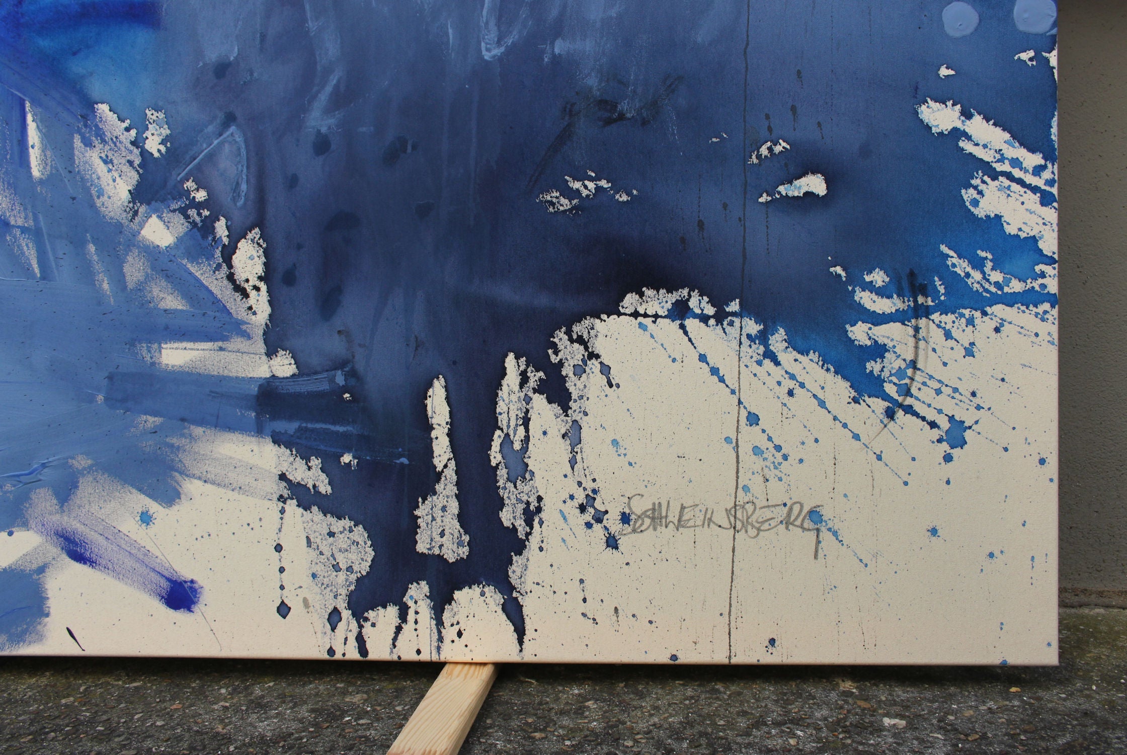 A blue and white painting on a white background.