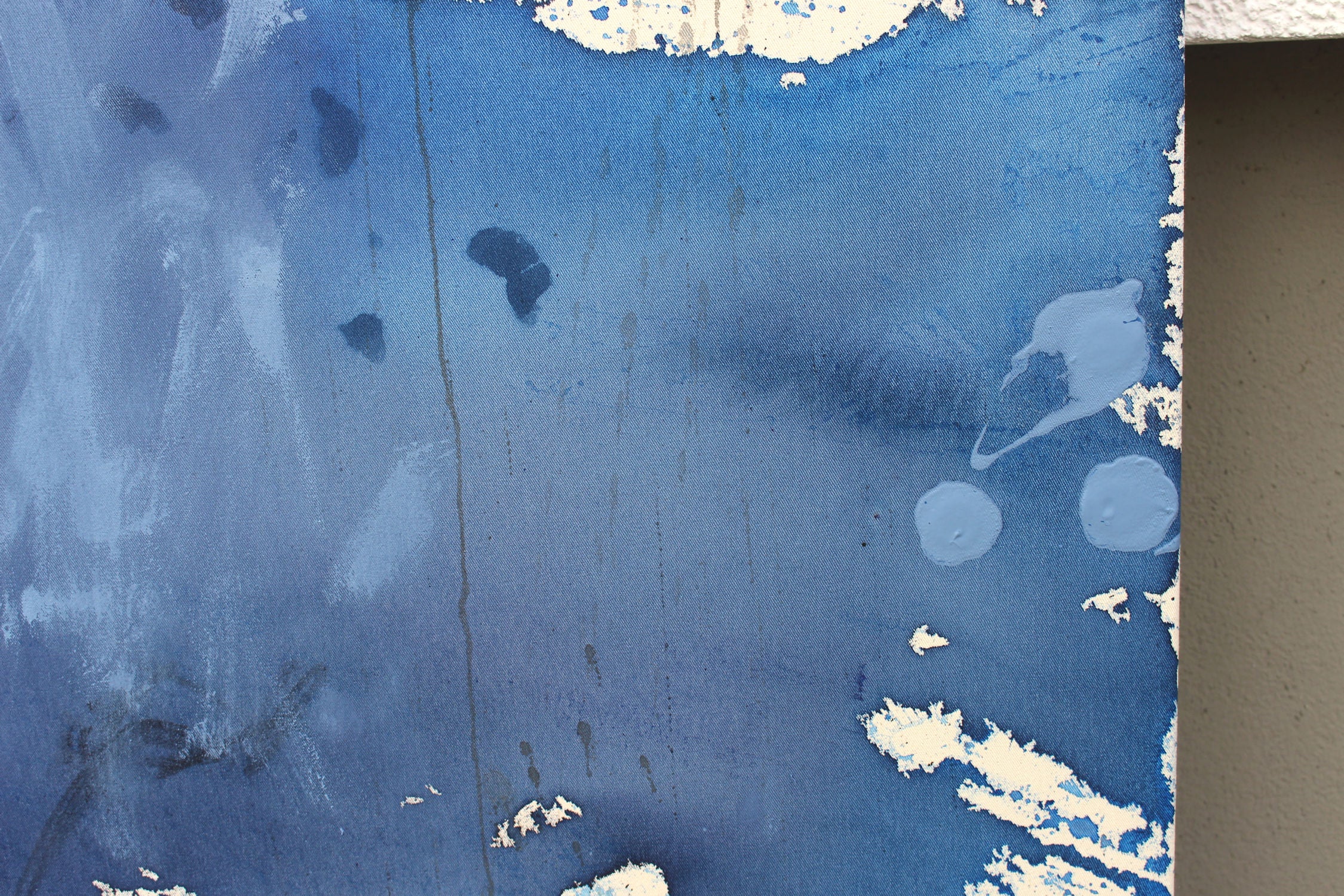 A blue and white painting on a white background.