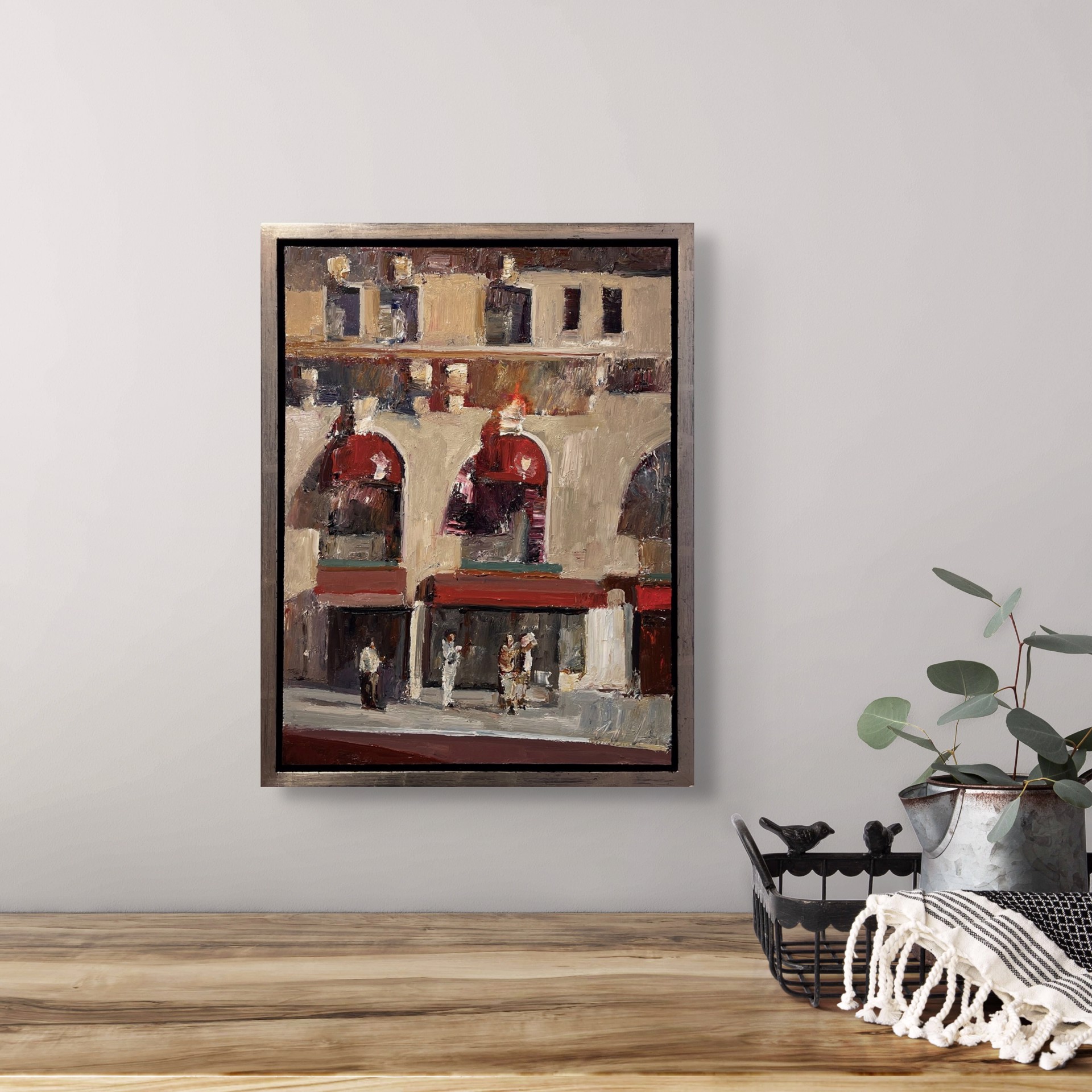 An expressive painting of a sunlit plaza with arched storefronts and figures gathered below.