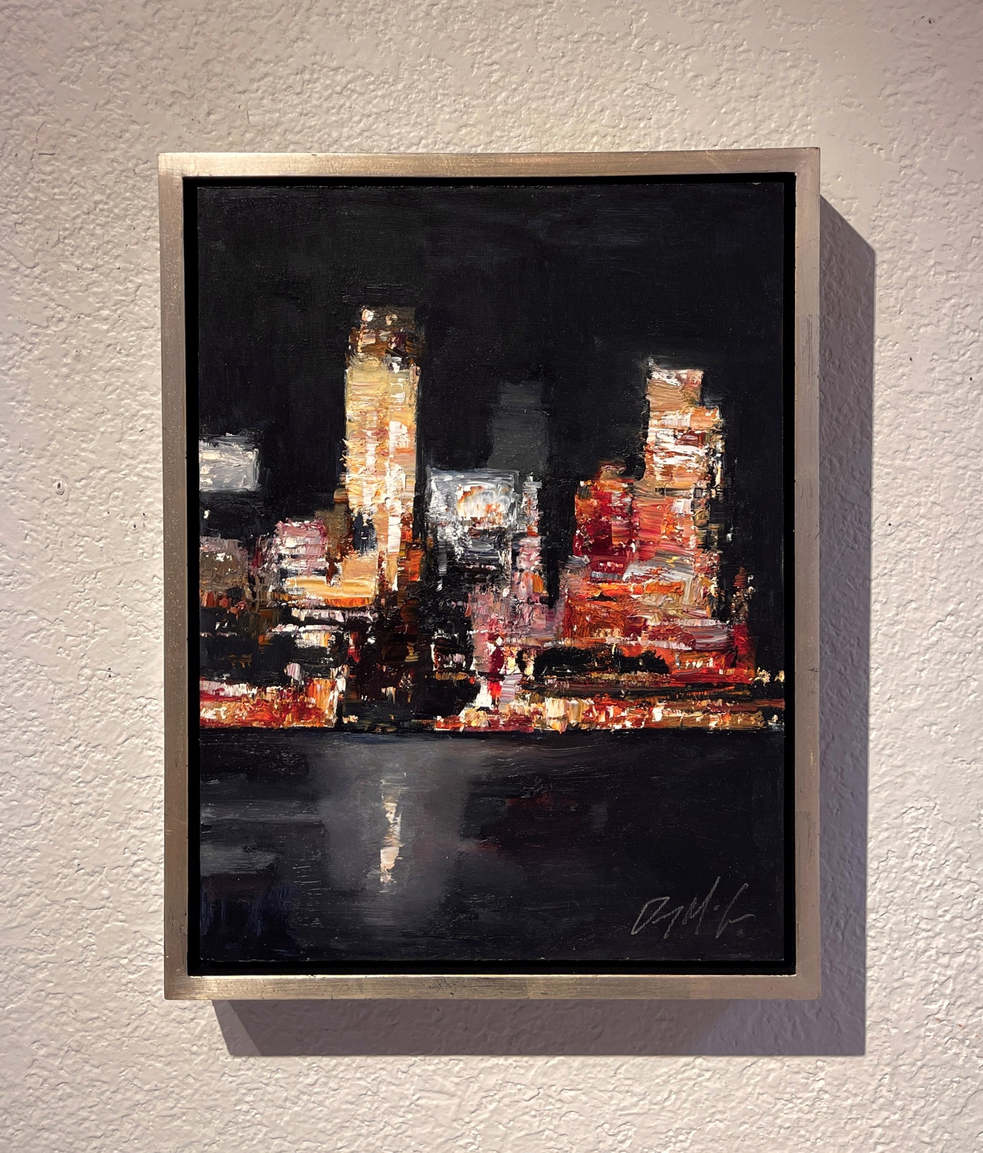 A nocturnal cityscape rendered in thick, expressive brushstrokes with a palette of warm oranges and deep blacks.
