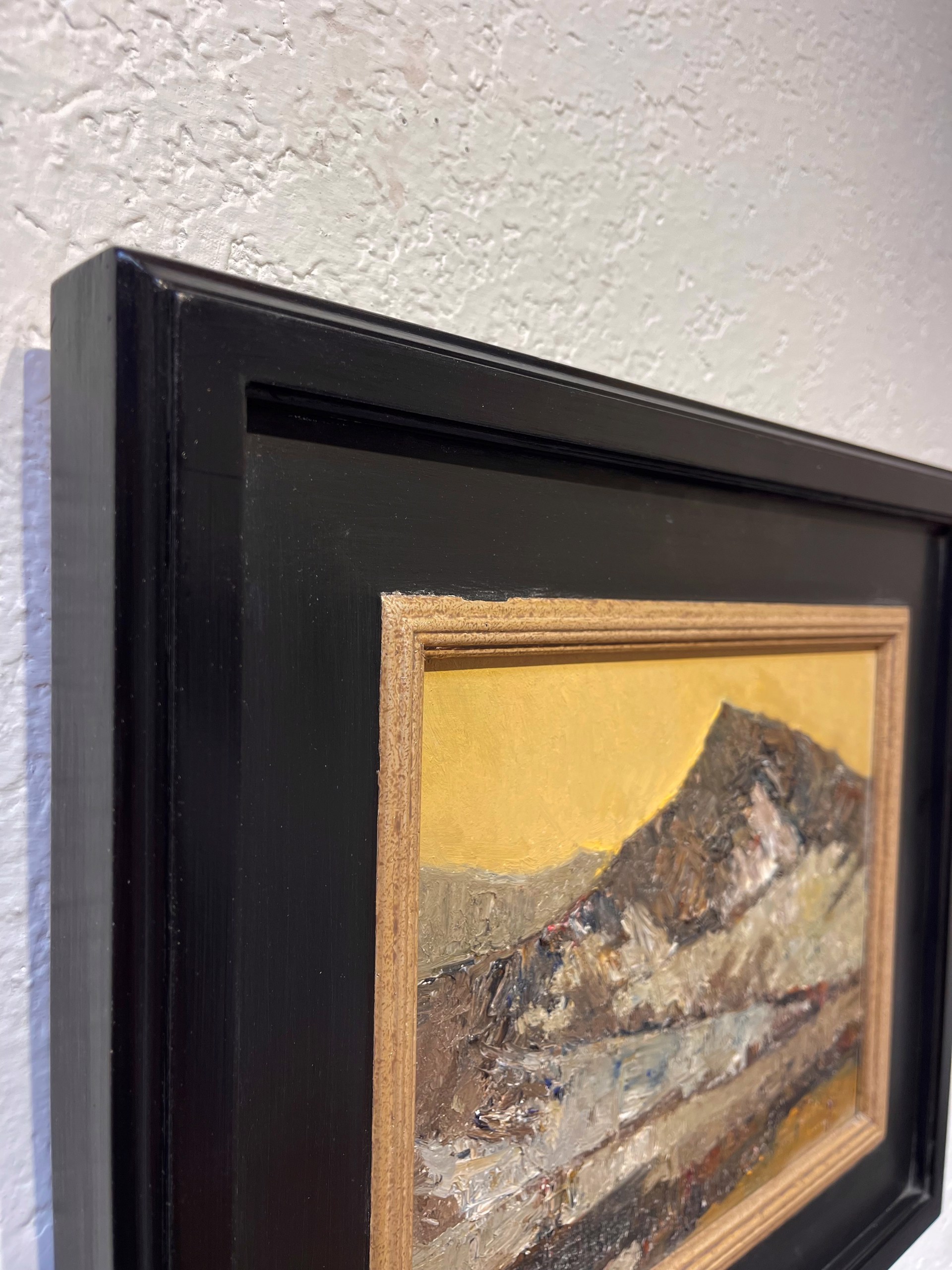 A painting of a mountain with a yellow sky in the background.