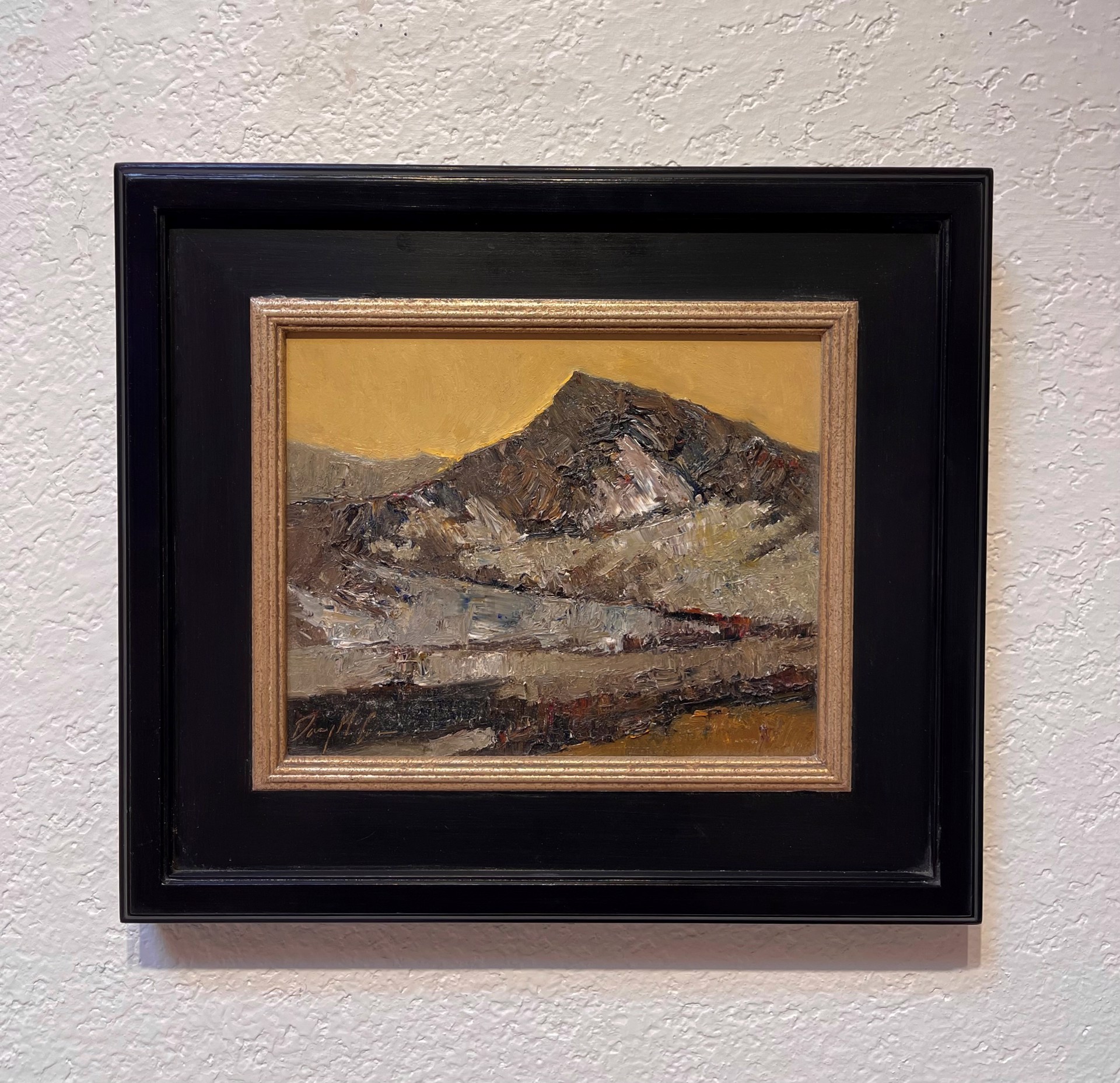 A painting of a mountain with a yellow sky in the background.